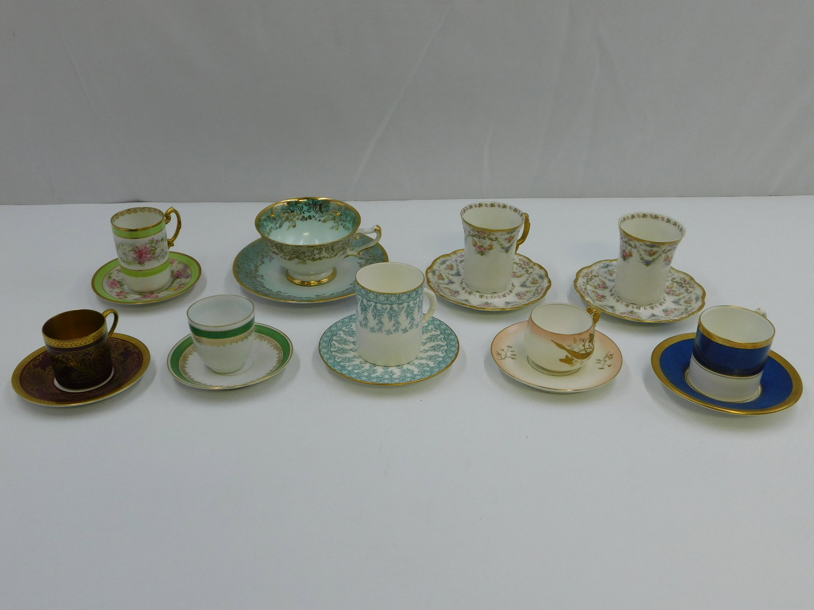 Lot of 9 Antique Cups and Saucers: Lot of 9 Antique Cups and Saucers including Limoges, Austria, German, Coalport, and More. Largest measures 4" tall x 5" wide. All invoices must be paid within 24 hours of the sale. Shipping options ar