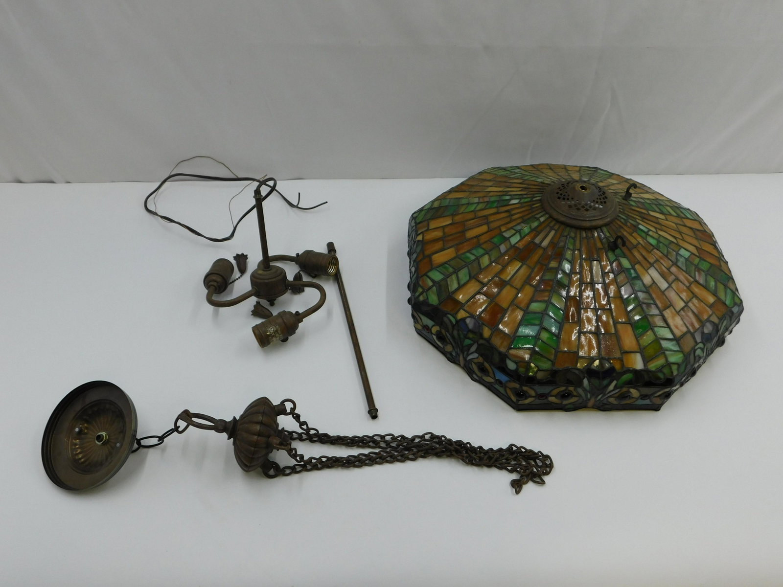 Leaded Glass Tiffany Style Hanging Chandelier: Leaded Glass Tiffany Style Hanging Chandelier. Signed Kichler. Missing 2 hooks on leaded glass to hang. Overall Quality Shape. Measures 20" diameter. All invoices must be paid within 24 hours of the s