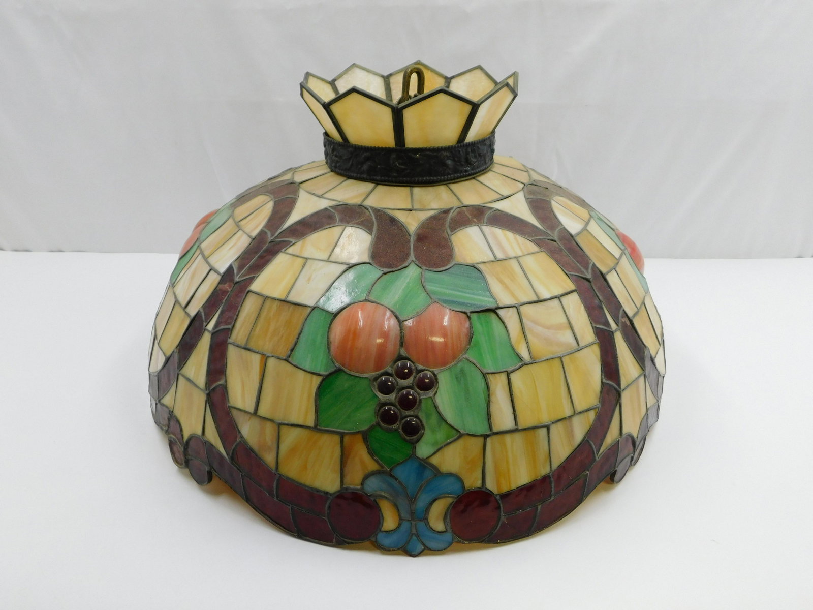 Leaded Glass Tiffany Style Hanging Chandelier: Leaded Glass Tiffany Style Hanging Chandelier. Has some cracks throughout. Measures 14" tall x 23" diameter. All invoices must be paid within 24 hours of the sale. Shipping options are the Liveaship f