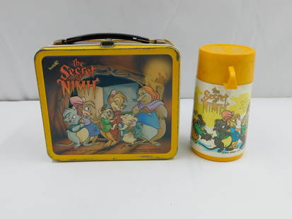 The Secret of NIMH Lunchbox and Thermos: The Secret of NIMH vintage lunchbox with original Thermos. Marked Mrs. Brisby LTD. Aladdin Industries Incorporated, Nashville Tenn. 37210 USA. Has some paint loss/rusting to the interior, the Thermos