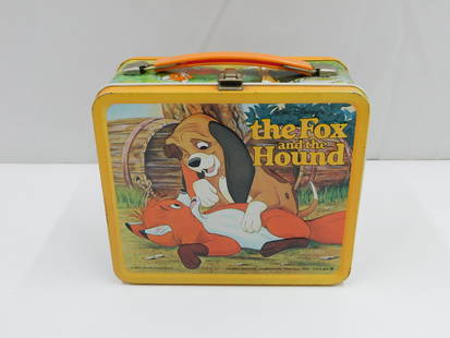 The Fox and the Hound Vintage Tin Lunchbox: Walt Disney's The Fox and the Hound vintage tin lunchbox. Marked Aladdin Industries Incorporated. Has minor rusting to the interior as well as scratching/rusting/paint loss throughout the exterior.