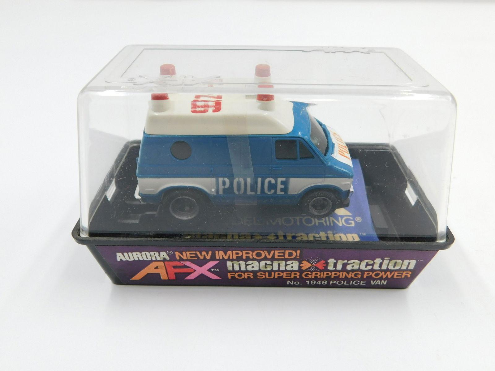 Aurora AFX Police Van Slot Car: Aurora AFX HO Scale Slot Car - Magna Traction. No. 1946 Police Van. Comes in original case. All invoices must be paid within 24 hours of the sale. There are 3 Shipping Options. Please read the Terms o