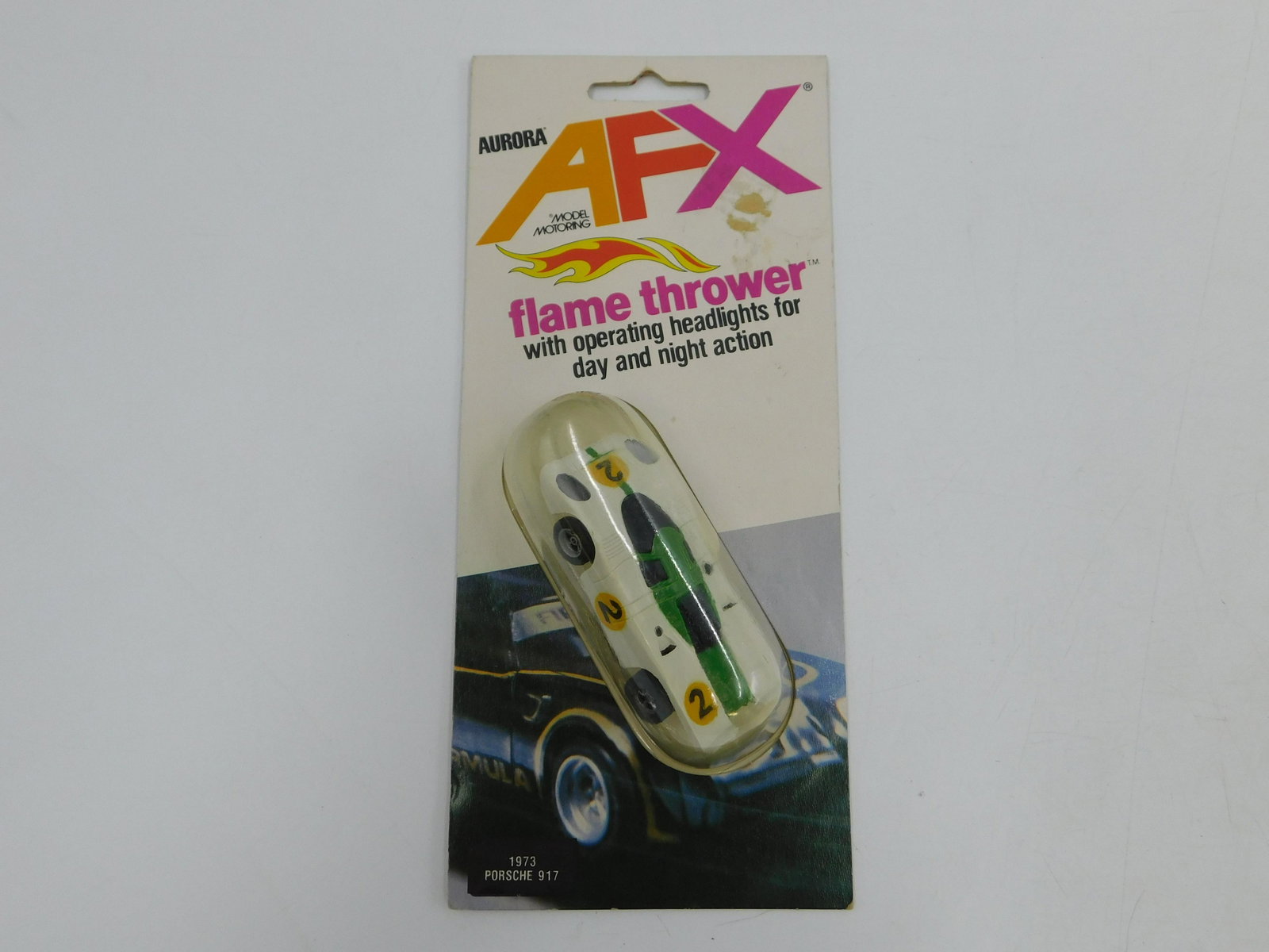 Aurora AFX Porsche 917 Slot Car: Aurora AFX HO Scale Slot Car - Flame Thrower. No. 1973 Porsche 917. Comes in original packaging. All invoices must be paid within 24 hours of the sale. There are 3 Shipping Options. Please read the Te