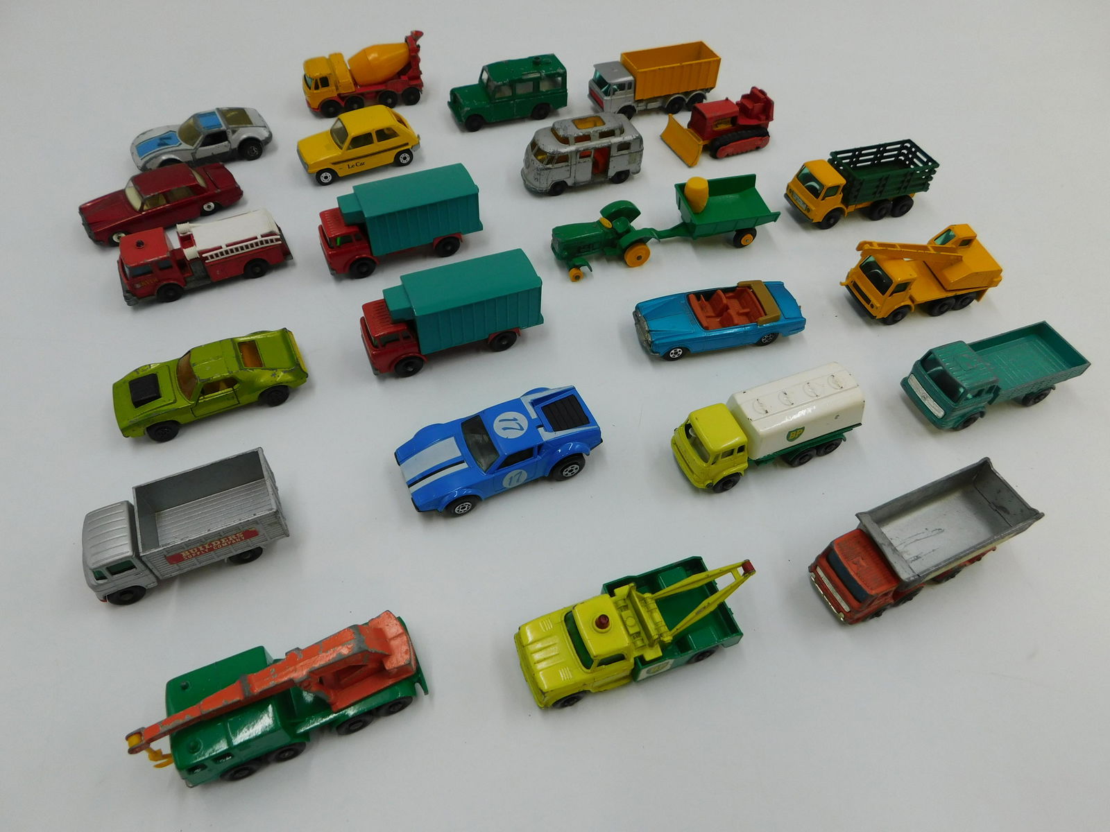 Lot of 24 Vintage Matchbox Cars: Lot of 24 Vintage Matchbox Cars including Rall-ye Royal, Renault 5TL, Land Rover Safari, AMX Javelin, Refrigerator Truck, Stake Truck, Petrol Tanker, Dodge Wreck Truck, Fire Pumper Truck and Many More