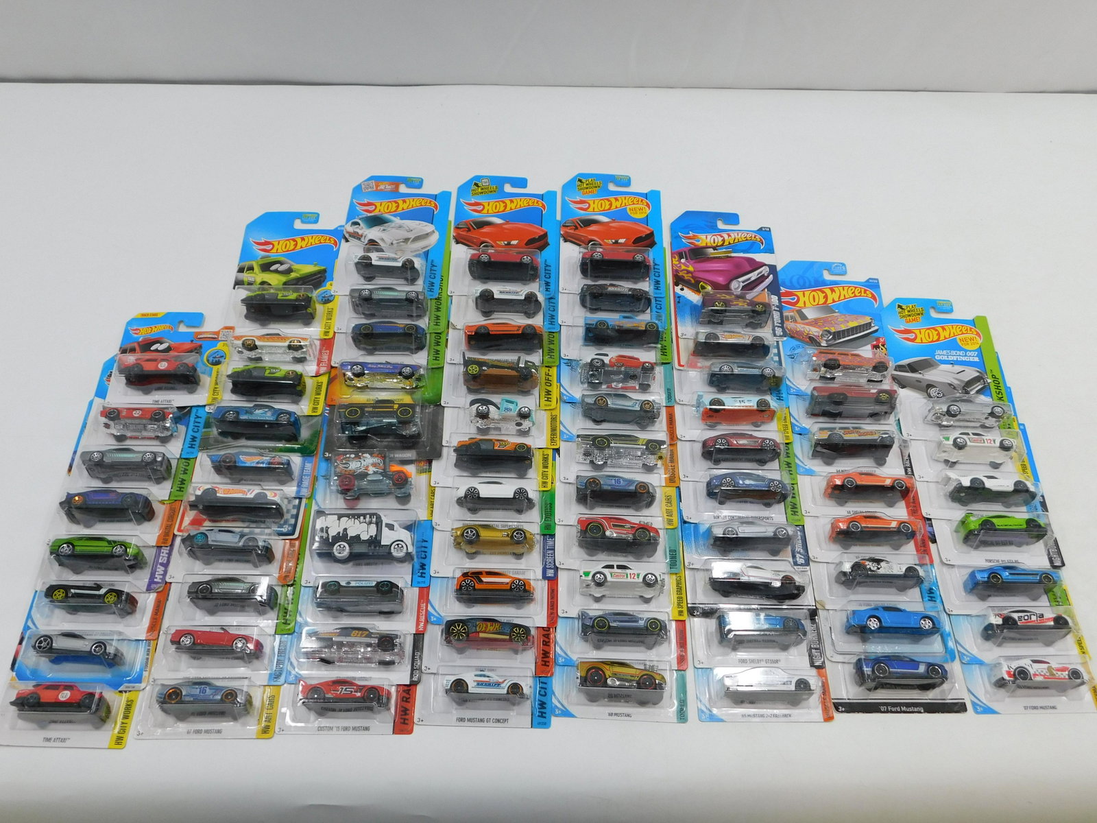 Lot of 75 Hot Wheels - All Mint on Card: Lot of 75 Hot Wheels - All Mint on Card. Some cars included in this lot are '70 Toyota Celica, '67 Pontiac GTO, '68 Plymouth Barracuda, 2005 Ford Mustang, '52 Hudson Hornet, Porsche 911 GT3 RS, Bentle