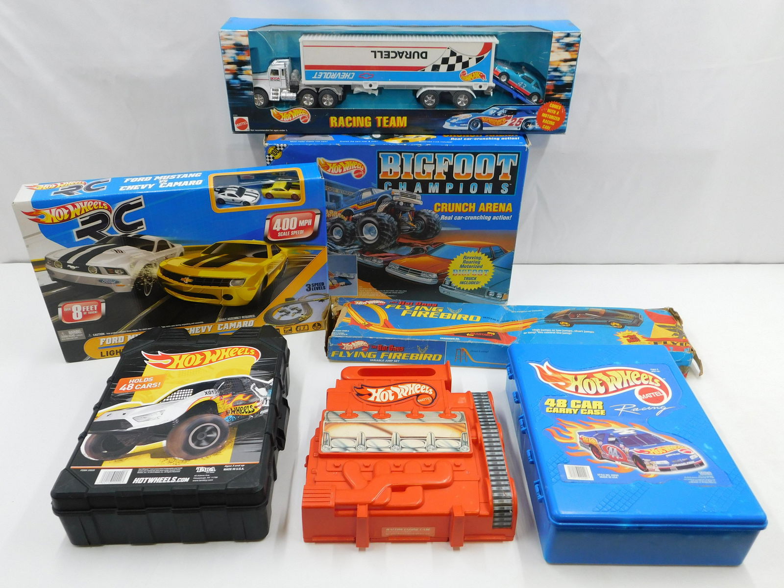 Lot of Mixed Hot Wheels Items: Lot of Mixed Hot Wheels Items including Hot Wheels RC - Ford Mustang vs. Camaro - Sealed, Hot Wheels Racing Team - Trailer Sticker on Upside Down, Hot Ones Flying Firebird - Track and Ramps - No Car -