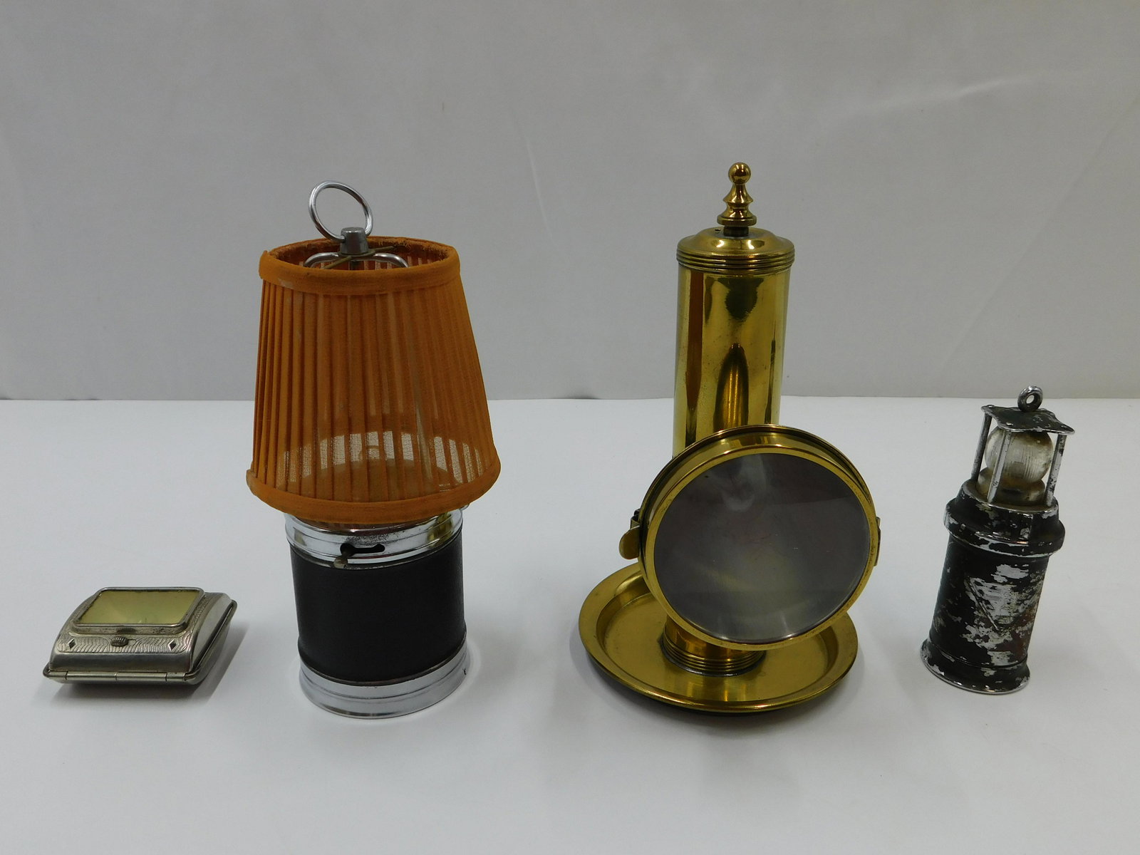 Lot of 4 Vintage Lanterns: Lot of 4 Vintage Lanterns including Cylinder Unit with Silk Shade in excellent condition, D.R.G.M. Small Black Lantern - Has rust and paint loss, Handheld Unit in very good condition, and Antique Bras