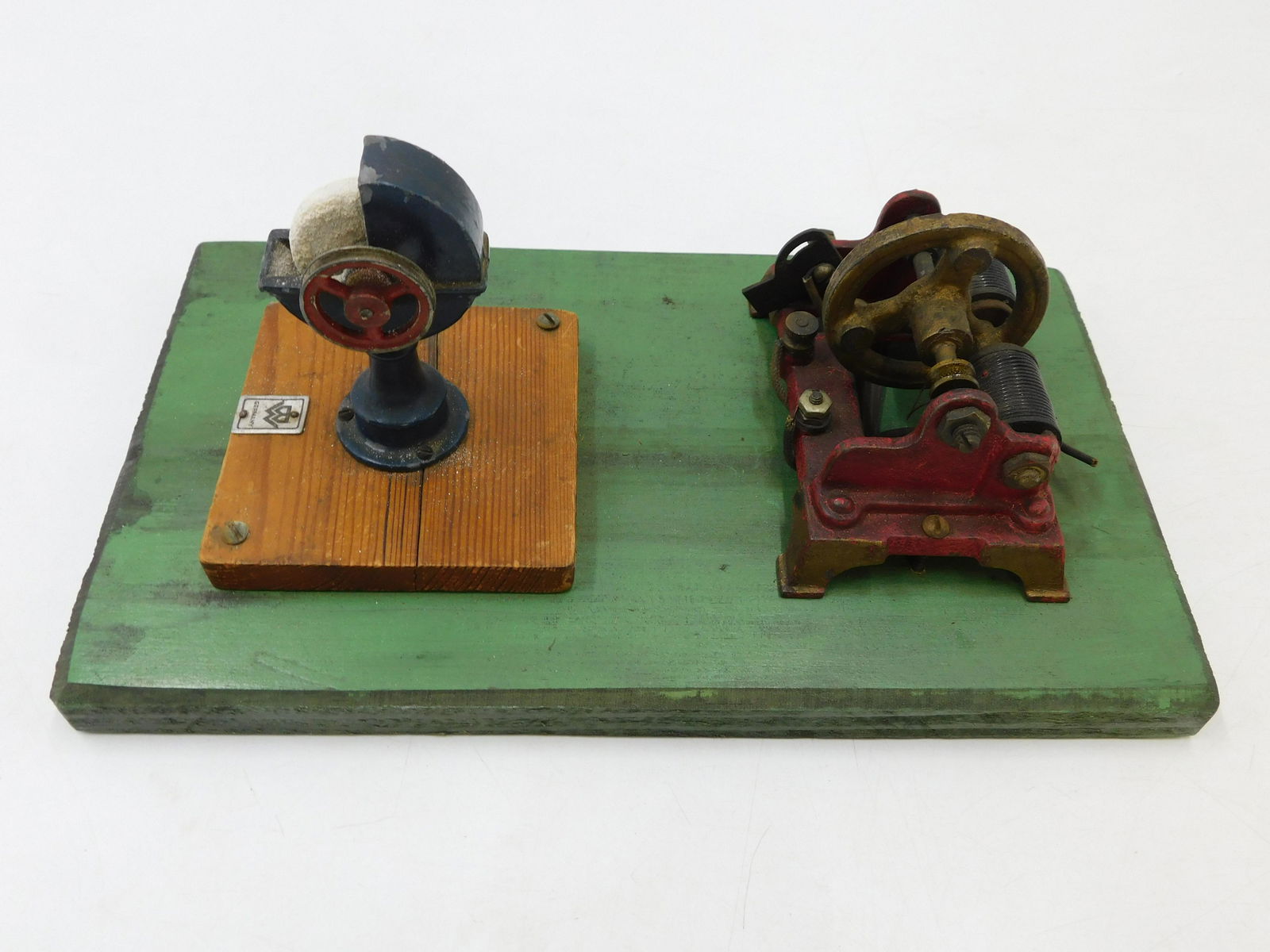 Antique German Engine with Working Sander: Antique German Engine with Working Sander. Mounted on Wood. Measures 5" tall x 11" wide. Not Tested. Appears to be complete but unsure if complete. All invoices must be paid within 24 hours of the sal