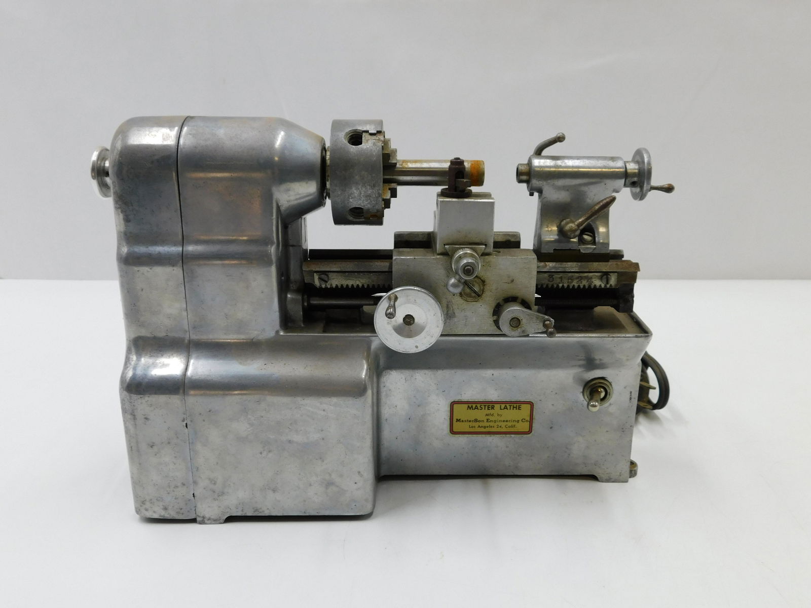 Electric Miniature Master Lathe: Electric Miniature Master Lathe Mfg. by Master Sons Engineering Company. Measures 8" tall x 10" wide. Not Tested. Appears to be complete but unsure if complete. All invoices must be paid within 24 hou