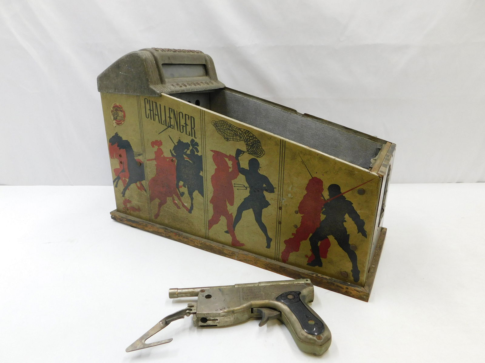 Antique Coin Operated "Challenger" Shooting Game: Antique Coin Operated Tabletop Shooting Game "Challenger". Missing glass front. Comes with Gun - Made by ABT Mfg. Co. Chicago. Needs Restoration. Measures 14" tall x 10" wide x 24" deep. All invoices