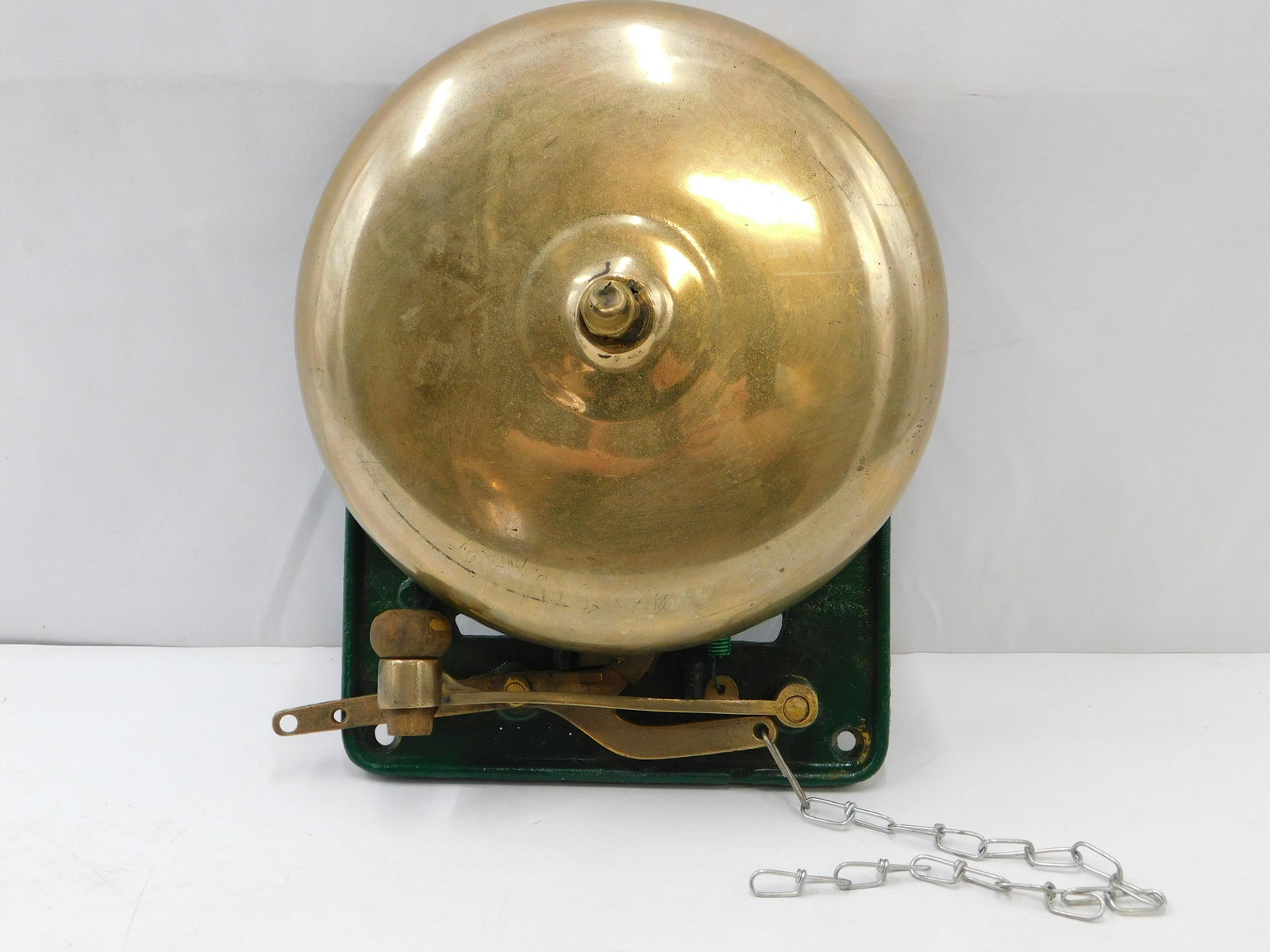 Antique Brass Oversized Shop/Ringside Bell: Antique Brass Oversized Shop/Ringside Bell. Comes on cast iron base that can be mounted. In working order. Measures 13" long x 10" diameter. All invoices must be paid within 24 hours of the sale. Ther