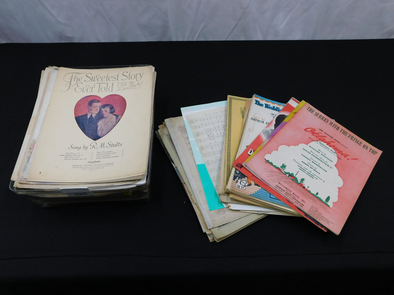 Lot of Sheet Music: Lot of Sheet Music including Umbrella Man, Oklahoma, Doll Dance, and other various piano and piano forte sheet music. Edges have fraying. All invoices must be paid within 24 hours of the sale. All ite
