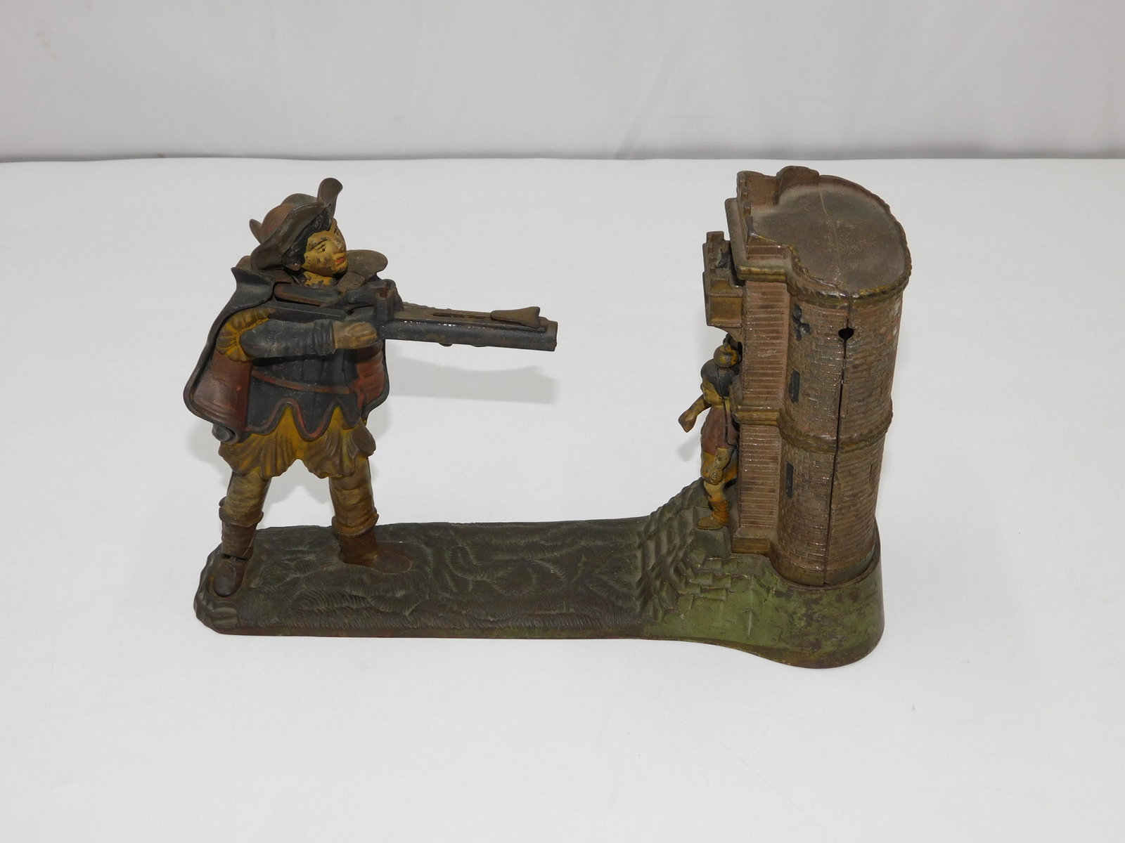 William Tell Cast Iron Mechanical Bank: William Tell Cast Iron Mechanical Bank. Man Chuting Apple on Boys Head in a Castle. Measures 7" tall x 10.5" wide. All invoices must be paid within 24 hours of the sale. There are 3 Shipping Options. 