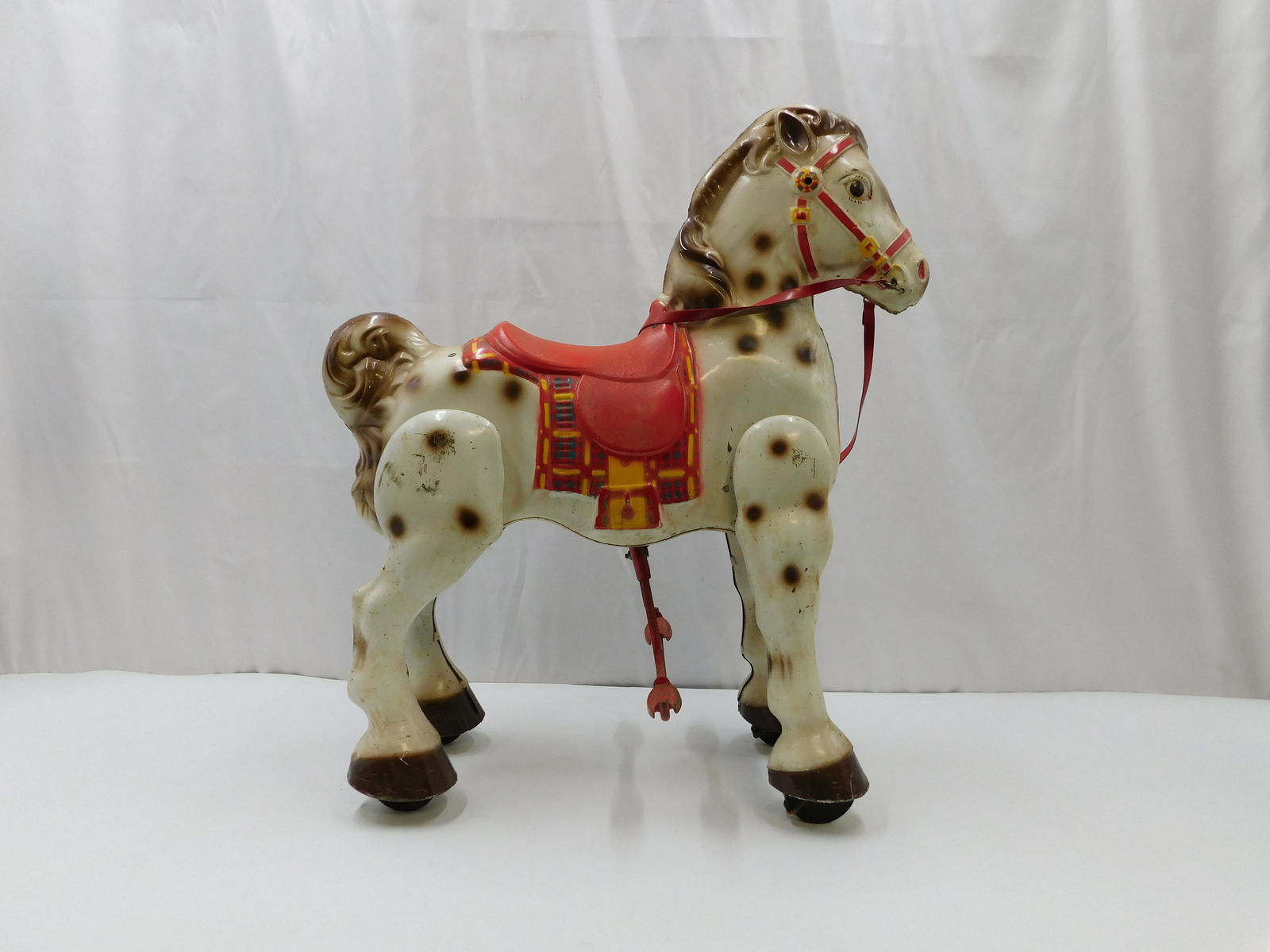 Antique Pressed Steel Mobo Ride-On Child's Horse: Antique Pressed Steel Mobo Ride-On Child's Horse/Bronco. Has factory holes for handles - handles missing. Has paint loss and significant scratching on legs. Overall good condition. Made in England. Me