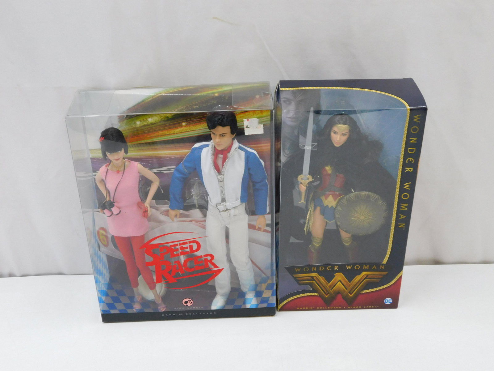Lot of 2 Barbie Dolls - Wonder Woman & Speed Racer: Lot of 2 Barbie Dolls including Wonder Woman - Black Label and Speed Racer Set - Pink Label. Both new in original boxes. All invoices must be paid within 24 hours of the sale. There are 3 Shipping Opt