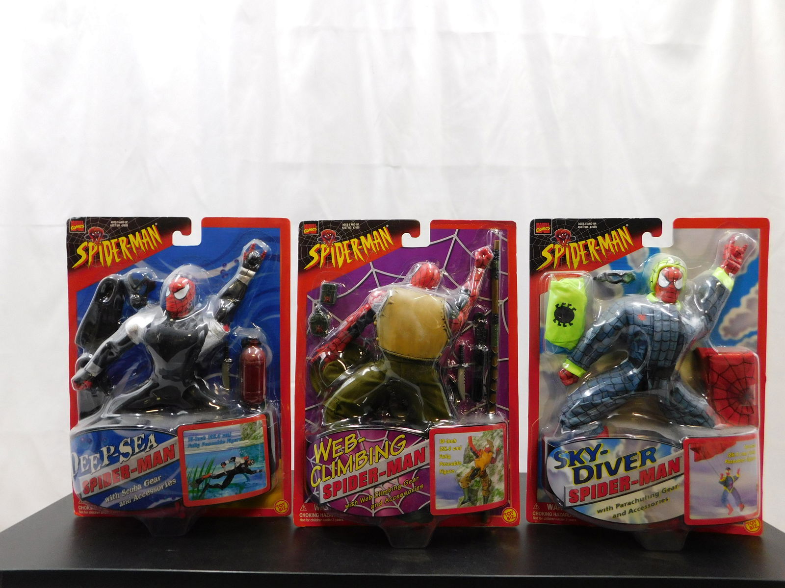 Lot of 3 Spider-Man 10" Figures: Lot of 3 Spider-Man 10" Figures including Web-Climbing Spider-Man, Deep Sea Spider-Man, and Sky-Diver Spider-Man. All new in packages. The packaging has some wear. All invoices must be paid within 24
