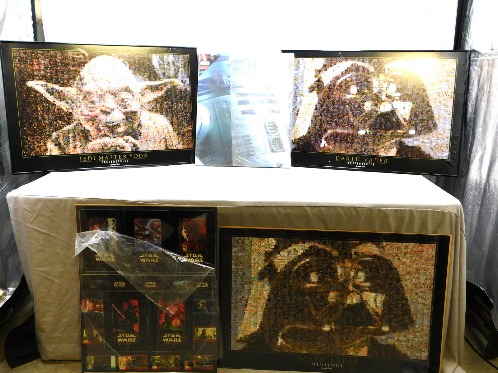 Lot of 5 Star Wars Posters/Prints: Lot of 5 Star Wars Posters/Prints including Illuminated Canvas R2-D2, Episode 1 Collage, Photomosiacs Jedi Master Yoda, and (2) Darth Vaders. All loose from frames or frames are AS-IS. Largest measure
