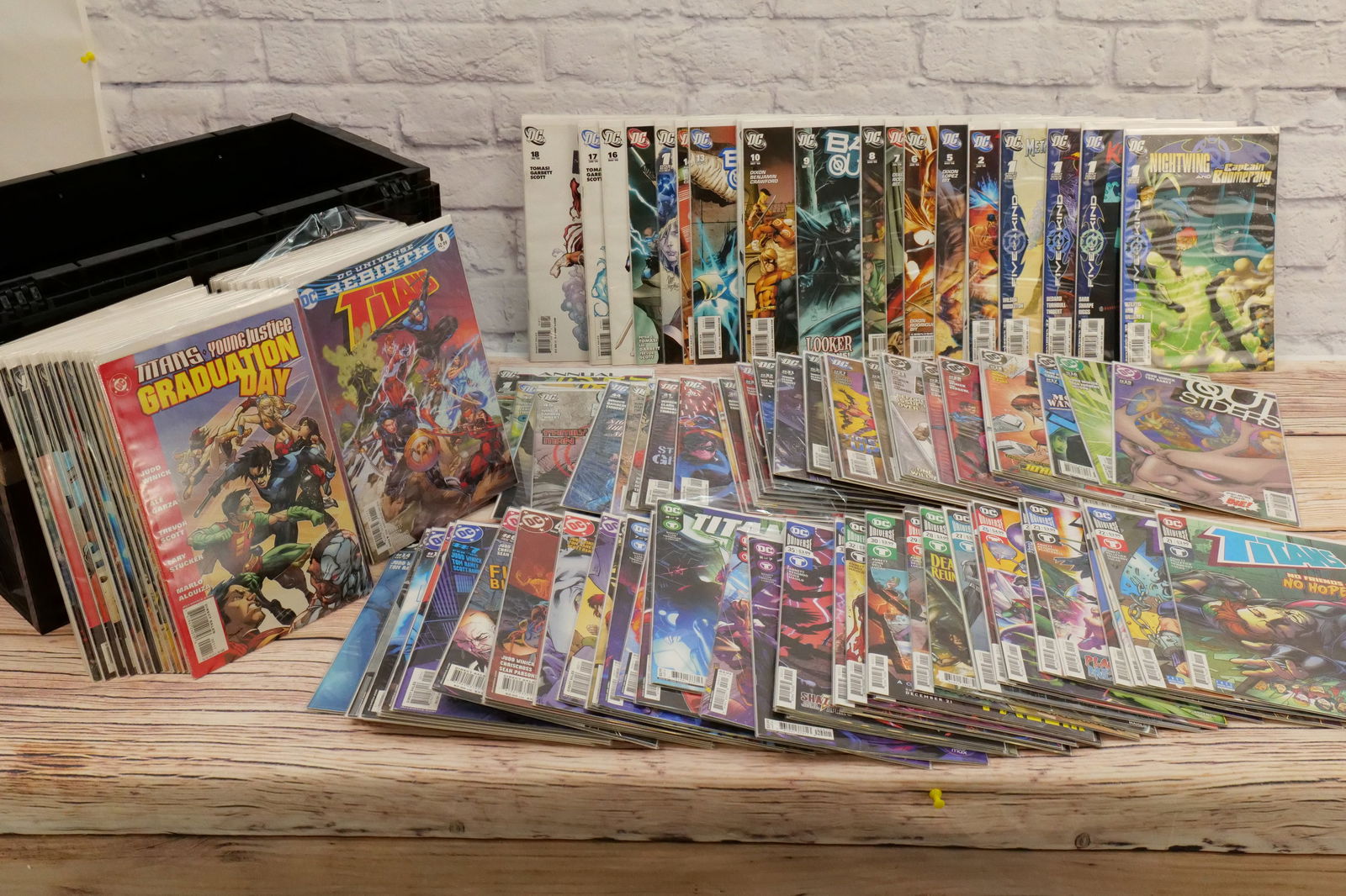 Short Box of Titans and Outsiders Comics - 2000's-2020's: Short Box of Titans and Outsiders Comics from the 2000's-2020's. Includes Titans, Titans Rebirth, Titans United, Outsiders, and Batman and The Outsiders. Box is 85% Full. Short Box Comes in a BCW Heav
