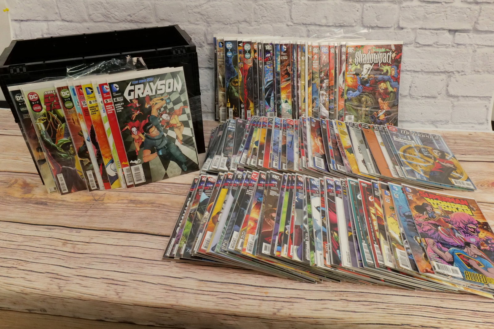 Short Box of DC Comics - 2000's-2020's: Short Box of DC Comics from the 2000's-2020's including Year of the Villain, Grayson, Deep Target, Superman/Batman, Shadow War, Superman Wonder Woman, Superman Metropolis and Shadow Pact. Box is Full.