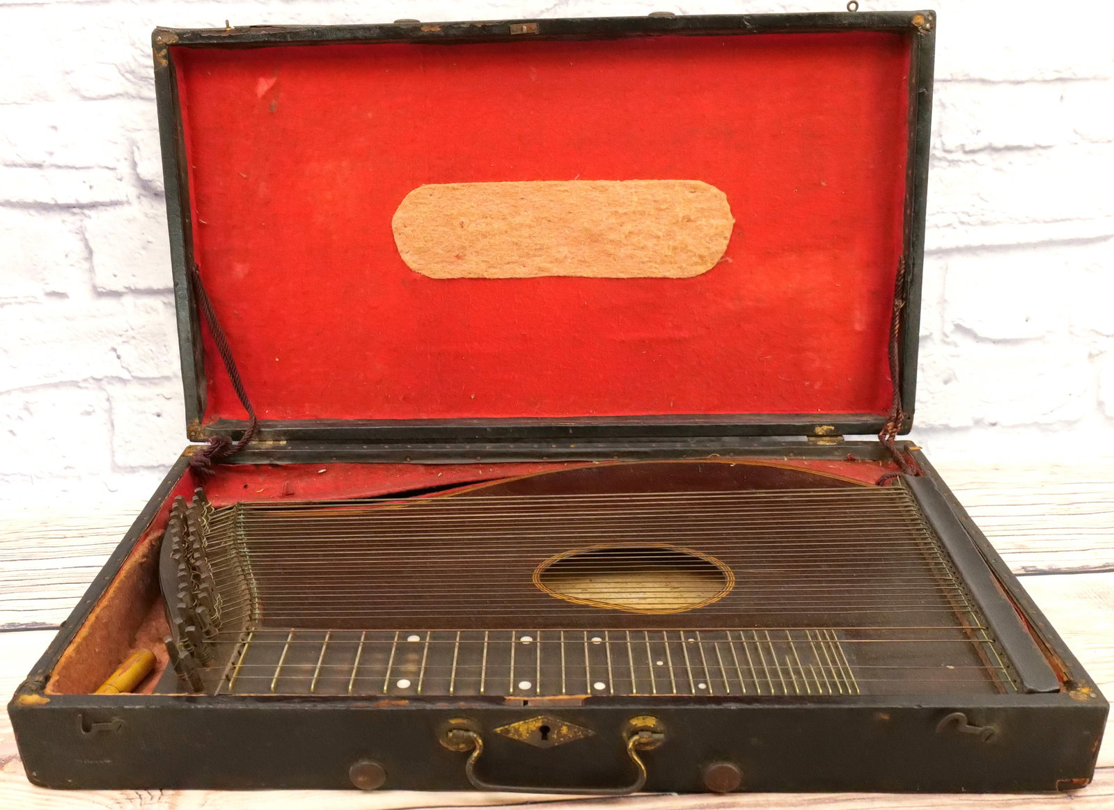 Antique Zither: Antique Zither. Does show minor warping and crack to backside. Comes in case. Measures approx. 20" long. All invoices must be paid for within 24 hours. We offer multiple shipping options, please read