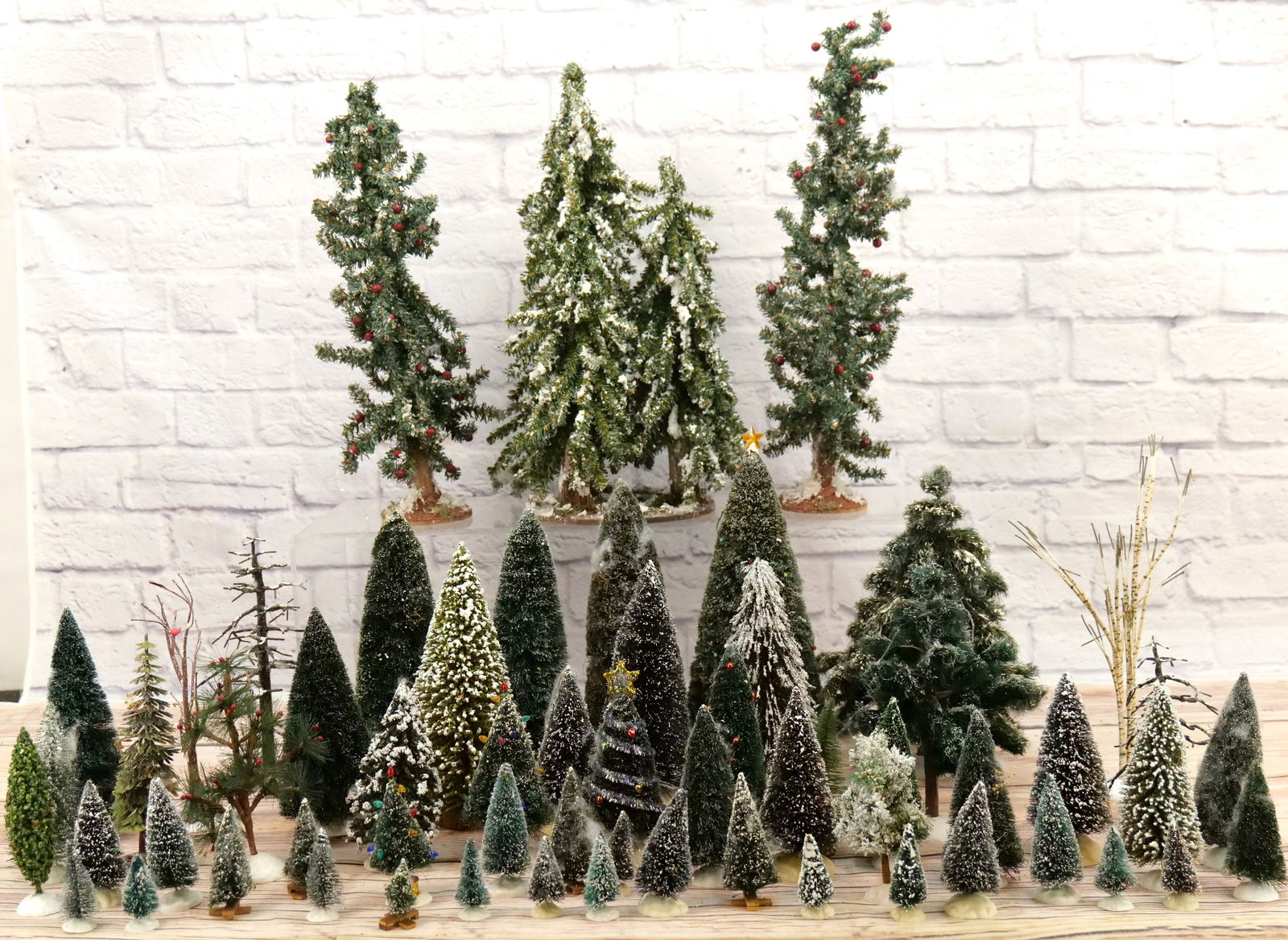 Large Lot of Department 56 Trees: Large Lot of Department 56 Trees. Loose - No Boxes. All Items in this sale have been on display and are in Used Condition. Most are assumed to not be complete or have small nicks/chips from being disp