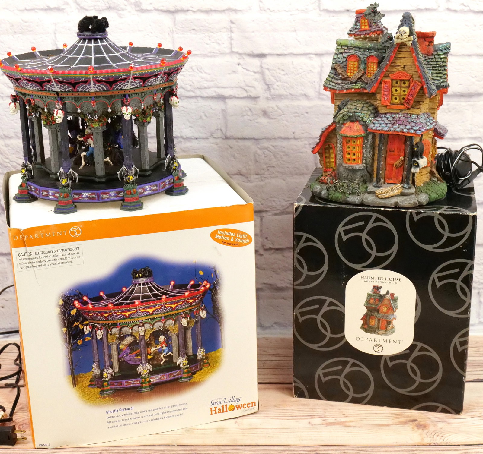 Lot of 2 Department 56 Halloween Items: Lot of 2 Department 56 Halloween Items including Fiber Optic Haunted House - Tested and Working - Appears to be in good condition and Snow Village Halloween Ghostly Carousel - Appears to be in good co