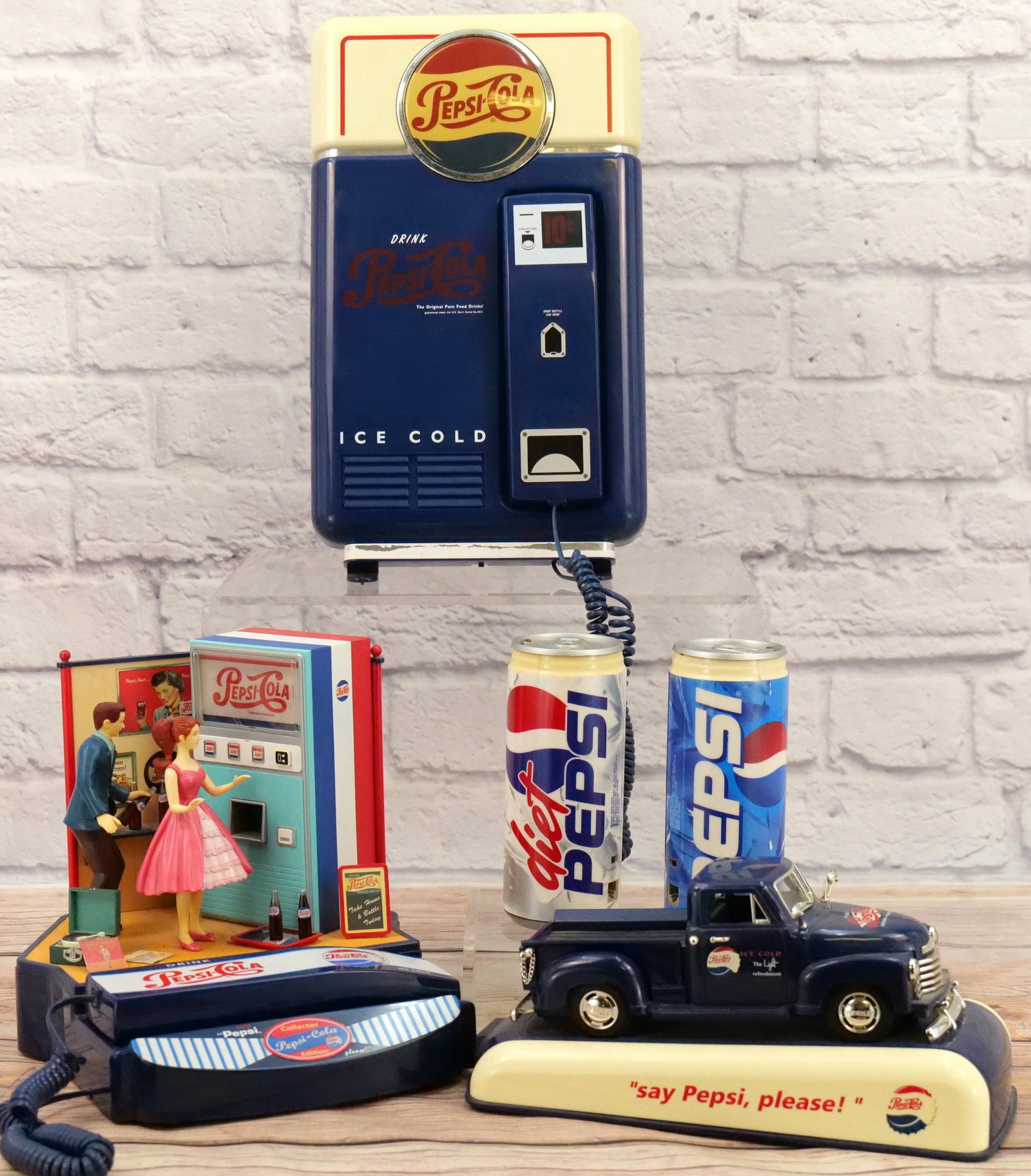 Lot of 5 Pepsi Novelty Telephones: Lot of 5 Pepsi Novelty Telephones. The Pick-Up Truck has a broken grill. One spike is broken off but the piece is included and appears that it can be glued back on. The silver paint has come off on th