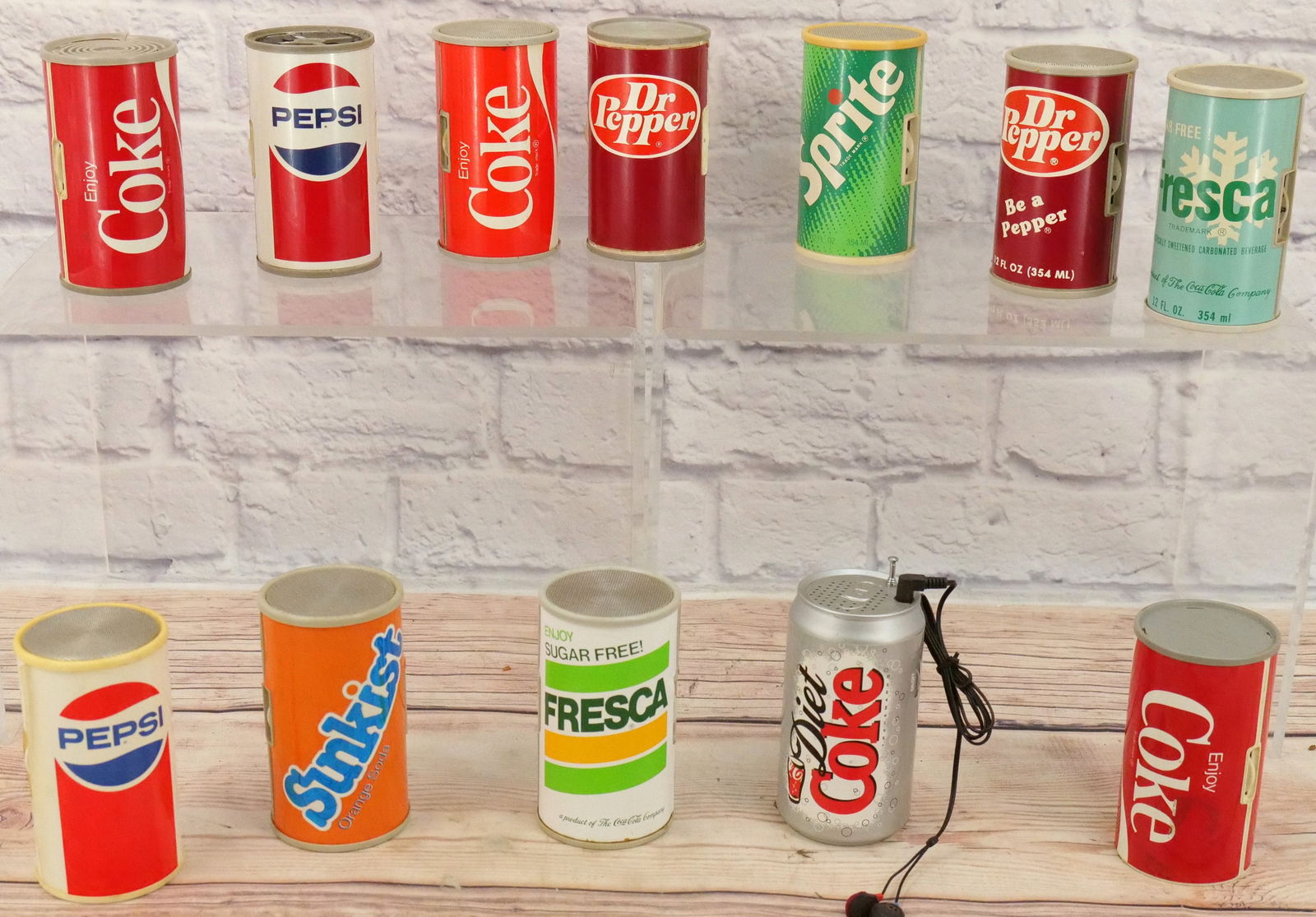 Lot of 10 Soda Can Novelty Radios: Lot of 10 Soda Can Novelty Radios including Coke, Sprite, Dr. Pepper, Fresca, Pepsi, and Sunkist. All in Used Condition. This Collection was displayed in the house and all items are untested. All invo