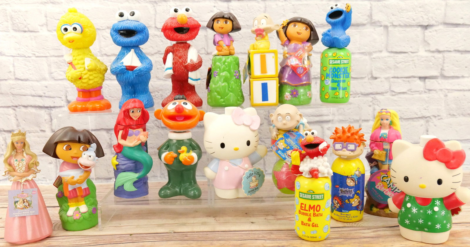 Large Lot of Cartoon/Toy Related Figural Bubble Baths: Large Lot of Cartoon/Toy Related Figural Bubble Baths. Includes Sesame Street Characters, Dora, Hello Kitty, Rugrats, The Little Mermaid and Barbie. Conditions vary. Some are still sealed. Some are to