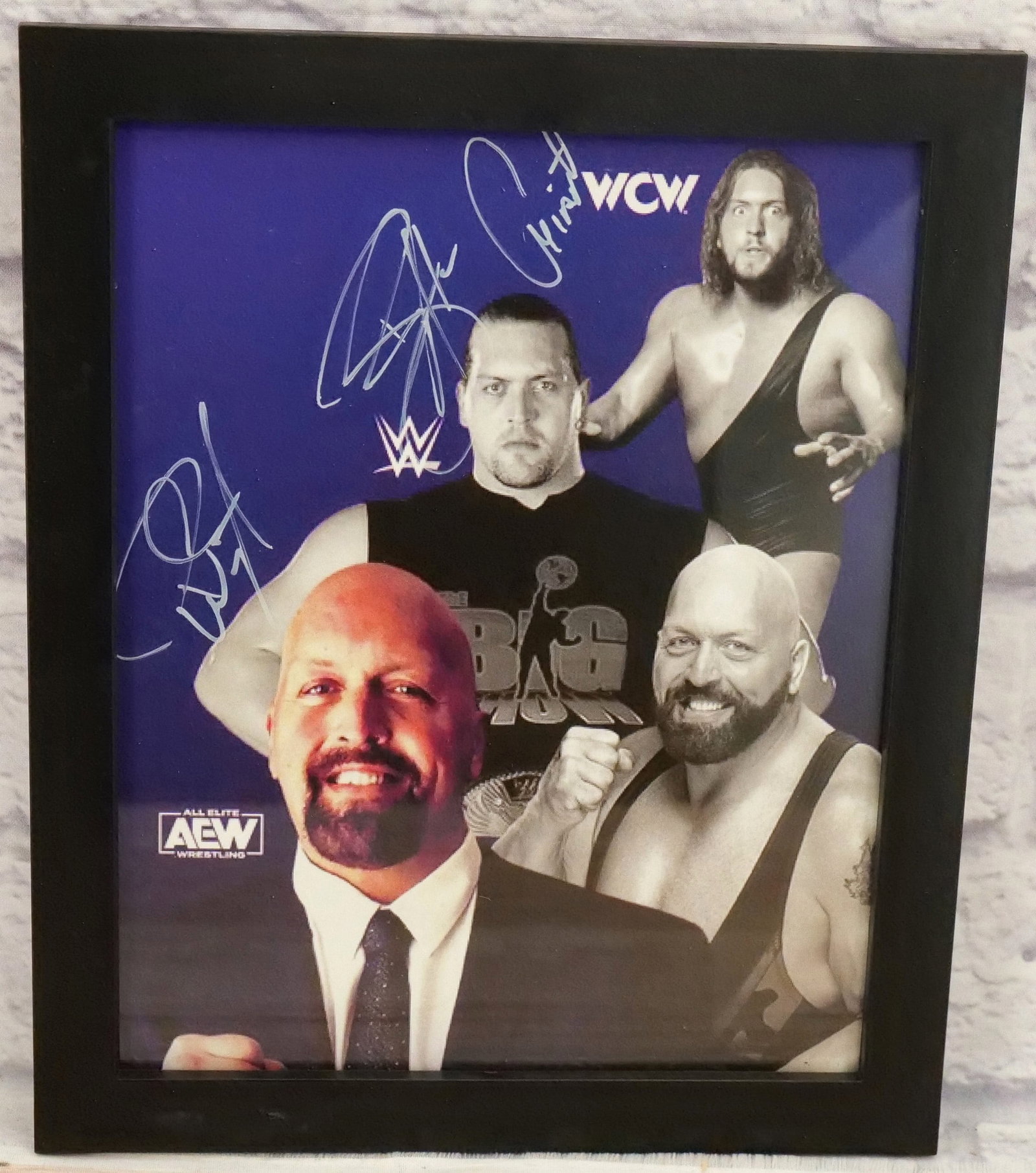 Triple Signed AEW Wrestling Print: Autographed AEW Wrestling Print. Includes signatures from Big Show, Giant, and Paul Wight?. Framed. Measures 11.25" tall x 9.5" wide. This autograph comes with a 30 day guarantee. It came from an esta