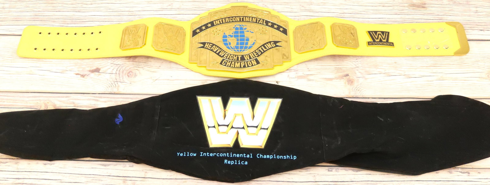 WWE Yellow Intercontinental Heavyweight Replica Championship Belt: WWE Yellow Intercontinental Heavyweight Replica Championship Belt. Belt has WWE Hologram on back. Comes with outer case. All invoices must be paid for within 24 hours. We offer multiple shipping optio