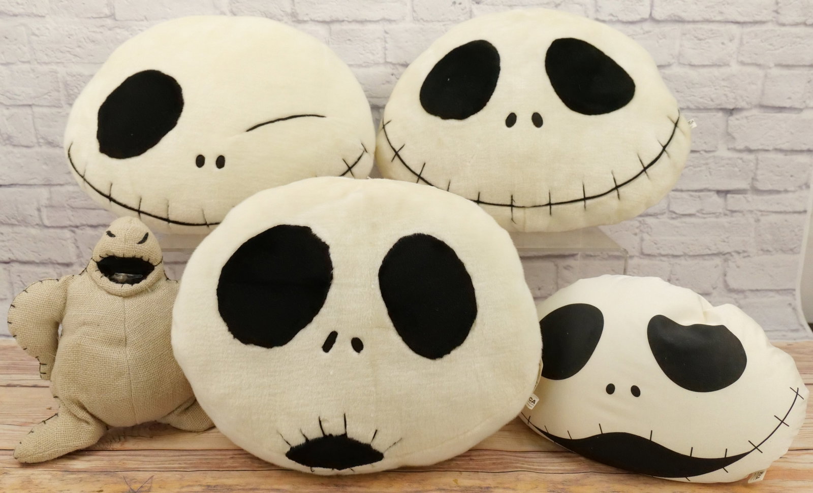 Lot of The Nightmare Before Christmas Plush and Beanbags: Lot of The Nightmare Before Christmas Plush and Beanbags. Includes (3) NECA Jack Faces, NECA Bean Bag Jack, and Applause Oogie Boogie. Some discoloration to plush. All invoices must be paid within 24 