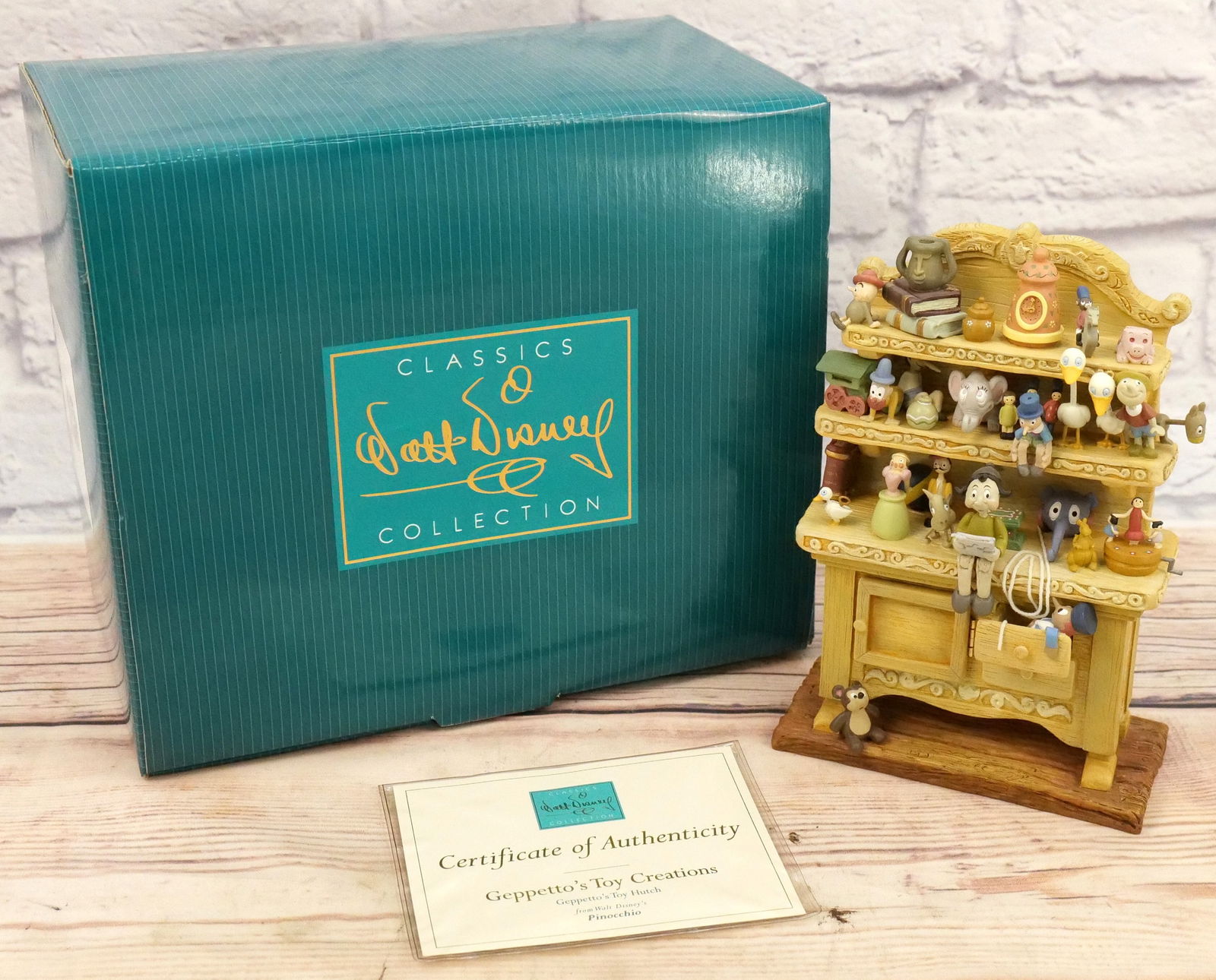 WDCC "Geppetto's Toy Creations" Figurine: WDCC "Geppetto's Toy Creations" Geppetto's Toy Hutch Figurine from Disney's Pinocchio. Comes with Box and COA. Measures approx. 8.5" tall. All invoices must be paid within 24 hours of the sale. We off