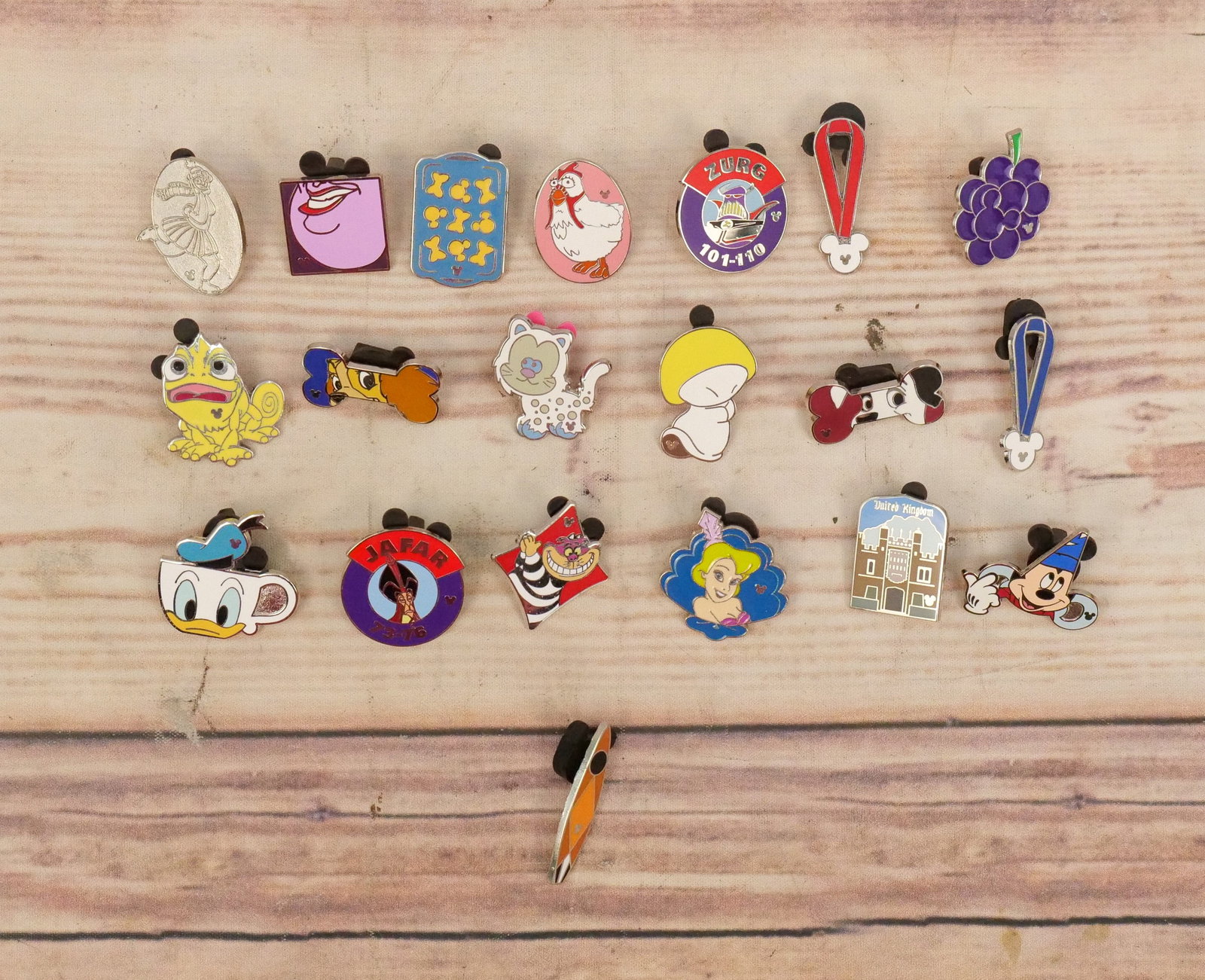 Lot of 20 Mixed Disney Pins: Lot of 20 Mixed Disney Pins including Surfboard, Fantasia Mushroom, Villains, Dog Bone, Tea Cup. Serving Tray and More. Many are Hidden Mickey Pins. All invoices must be paid within 24 hours of the sa