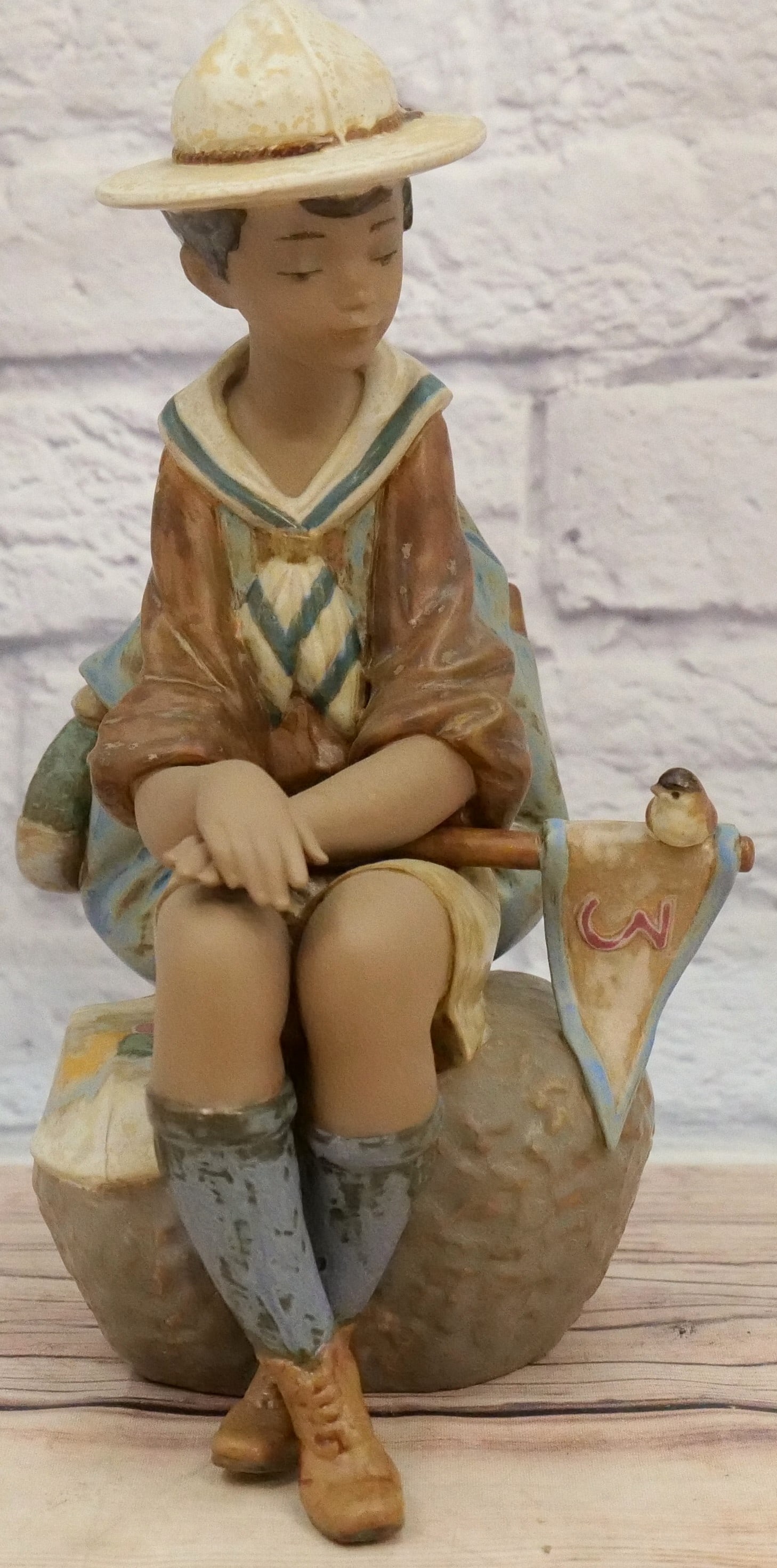 Lladro Patrol Leader Figurine: Lladro Patrol Leader Figurine - #2212 - Matte Finish. Depicting Young Scout Seated. Measures 12" tall x 7" wide. All invoices must be paid within 24 hours of the sale. We offer multiple shipping optio