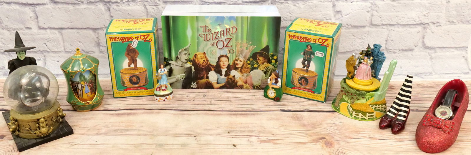 Group Lot of Wizard of Oz Items: Group Lot of Wizard of Oz Items including Dorothy Red Slipper Watch, Wicked Witch of the West Warner Bros Studio Watch Holder with Watch, Westland Dorothy Clock, Dorothy Pill Box with Red Slippers, Mi