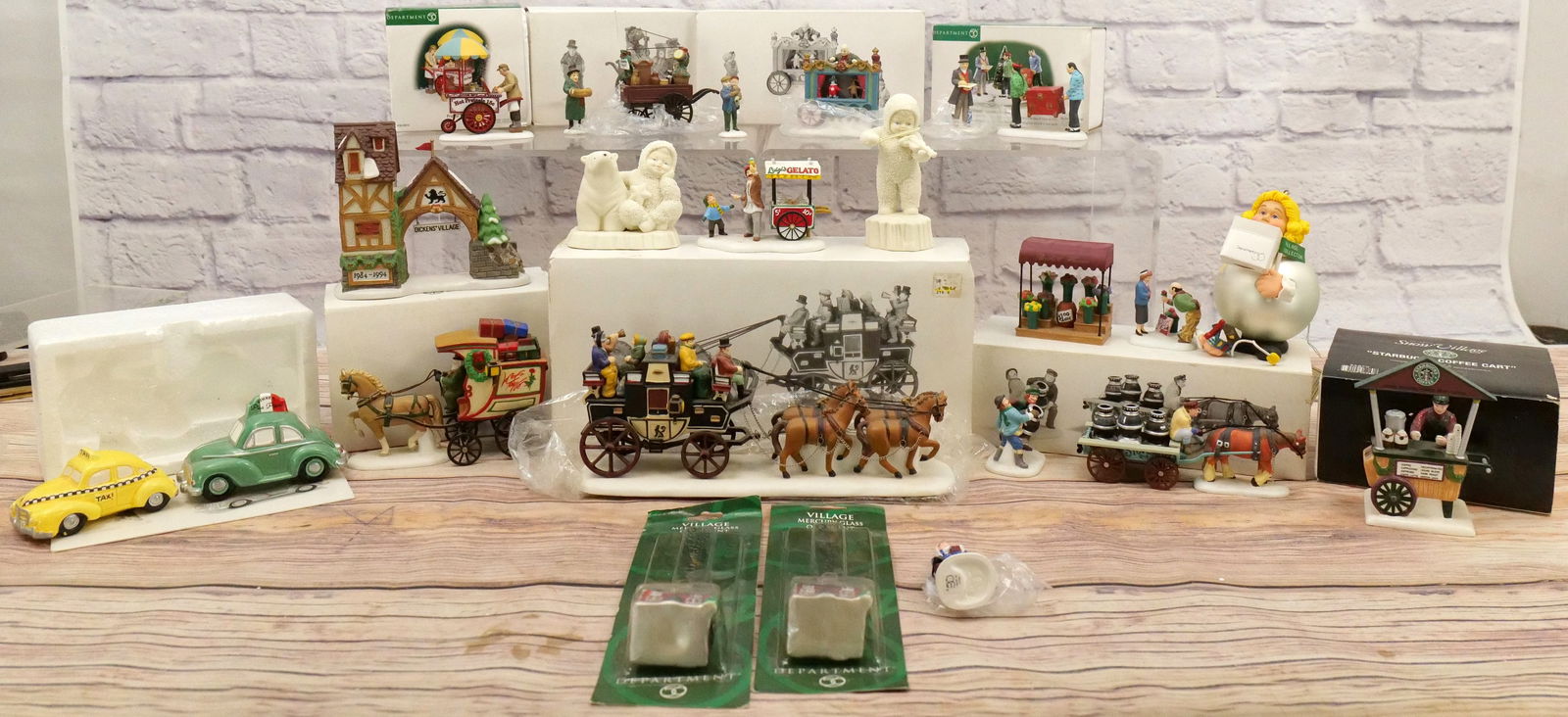 Large Lot of Christmas Accessories: Large Lot of Christmas Accessories including Many Dept. 56. Dept. 56 Accessories include Holiday Coach, Fresh Flowers for Sale, The Old Puppeteer, Starbucks Coffee Cart, Lord & Taylor Wagon, Pretzel C
