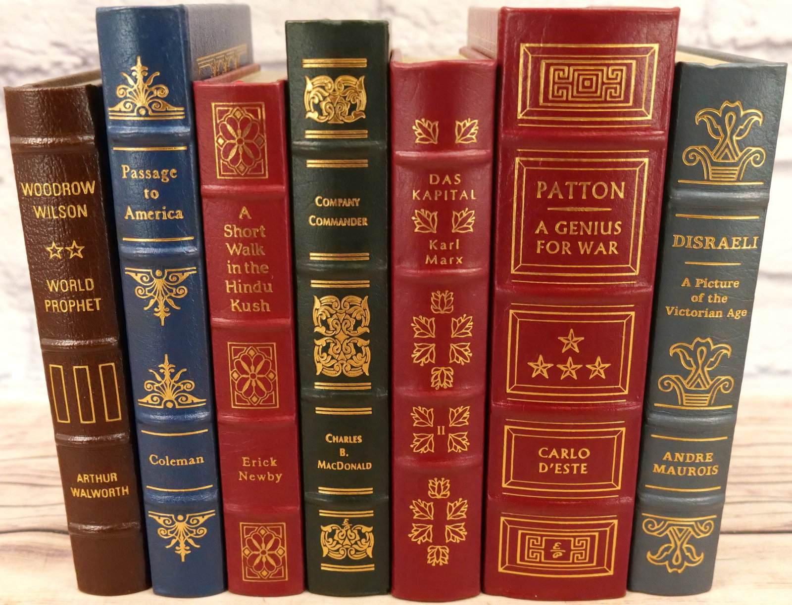 Lot of 7 Easton Press Leather Bound Books: Lot of 7 Easton Press Leather Bound Books including Patton, Das Kapital, Company Commander, A Short Walk in the Hindu Kush, Passage to America, Woodrow Wilson, and Disraeli. All in excellent condition