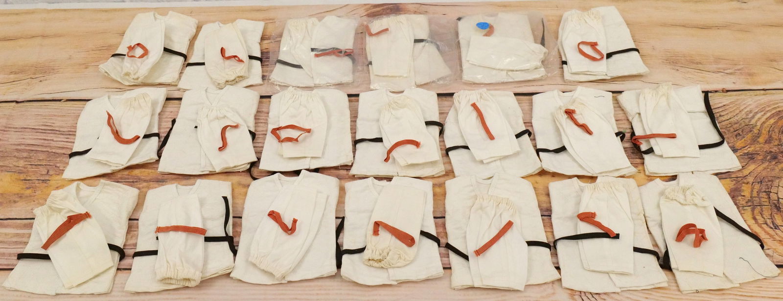 Lot of 20 James Bond Odd Job Karate Outfits: Lot of 20 James Bond Odd Job Karate Outfits by AC Gilbert Co. Japan. The outfits are complete. Some minor light discoloration present on a couple sets. All invoices must be paid within 24 hours of the