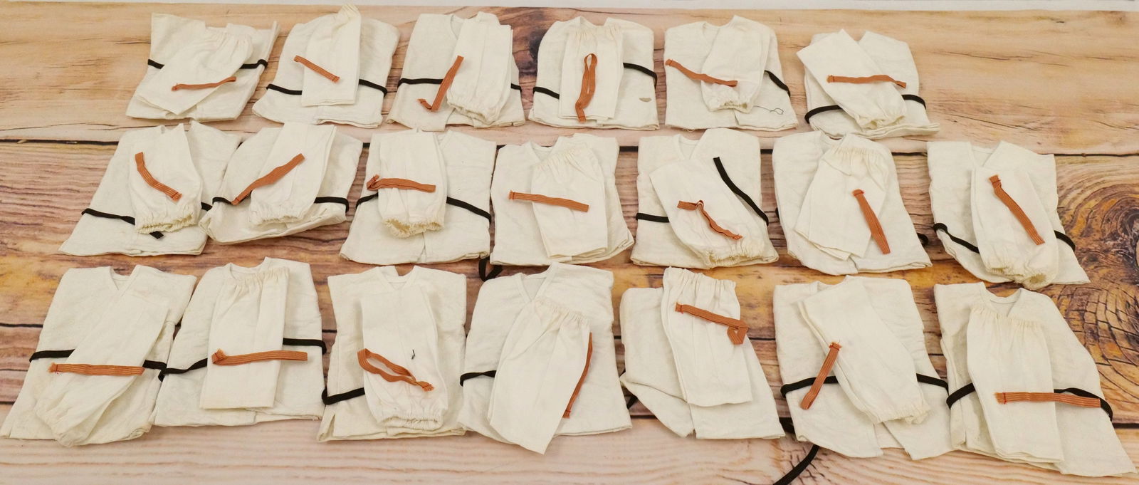 Lot of 20 James Bond Odd Job Karate Outfits: Lot of 20 James Bond Odd Job Karate Outfits by AC Gilbert Co. Japan. The outfits are complete. Some minor light discoloration present on a couple sets. All invoices must be paid within 24 hours of the