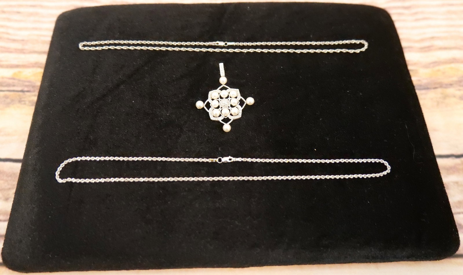 Lot of 14k White Gold Jewelry: 14k White Gold Jewelry Lot including (2) 14k Rope Chain and Pearl and Diamond Chip Pendant. All marked. Chains measure 14"-15". Pendant measures 1.75". All invoices must be paid within 24 hours of the