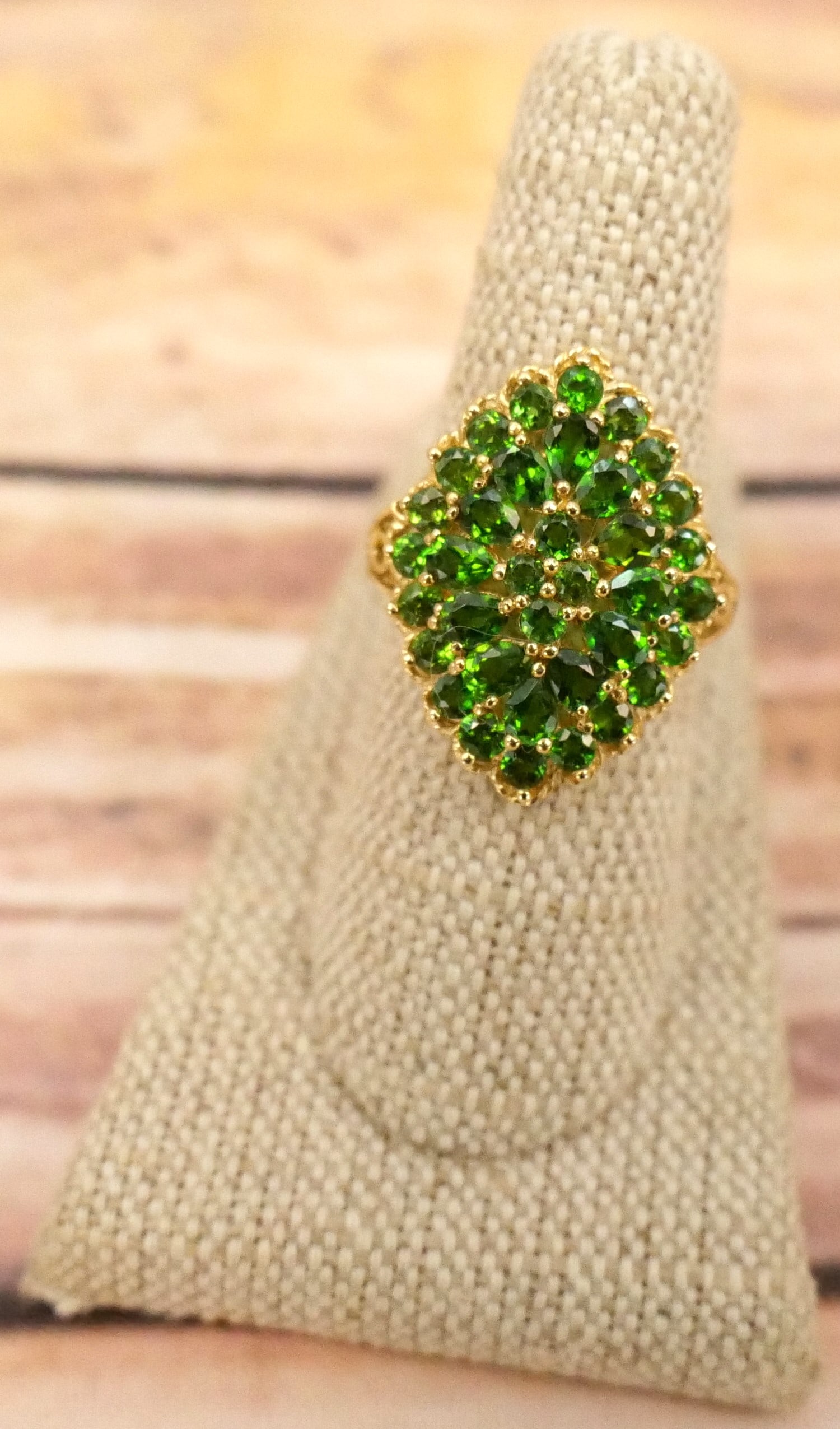 14k Yellow Gold Ladies Ring: 14k Yellow Gold Ladies Ring with Many Round and Pear Shaped Green Gemstones. Marked. Size 8. All invoices must be paid within 24 hours of the sale. We offer multiple shipping options, please read the