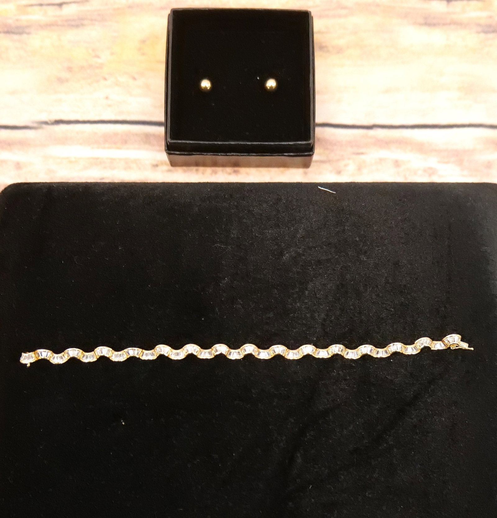Lot of 14k Jewelry: Lot of 14k Jewelry including Pair of Gold Studs and 14k Yellow Gold Tennis Style Bracelet with Clear Stones. All Marked. Bracelet measures 7.5". All invoices must be paid within 24 hours of the sale. 
