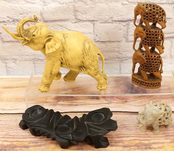 Lot of Asian Influenced Elephant Figurines: Lot of Asian Influenced Elephant Figurines including Hard Stone Hand Carved Elephant inside an Elephant, Hand Carved Wooden Statue depicting 3 Elephants standing on top each other with Elephants carve