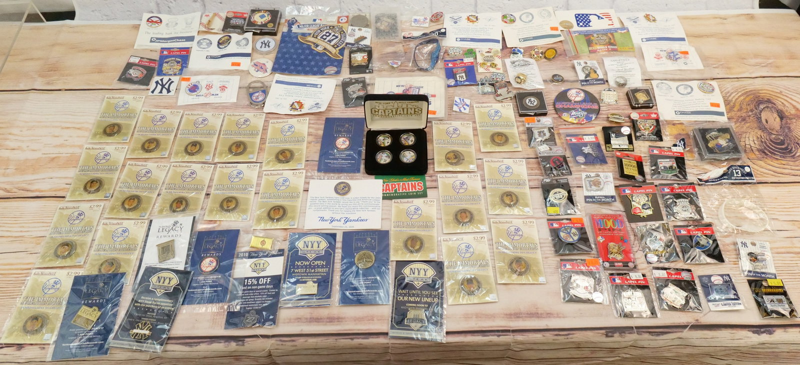 Large Lot of New York Yankees Pins and Collectibles: Large Lot of New York Yankees Pins and Collectibles including Replica Rings, Patches, Legacy Pins, Immortals Pins, and other Various Yankees Pins and Promotional Pins. Large Lot - 80+ Pins. All invoic