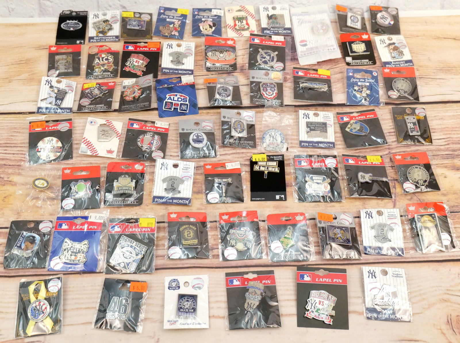 Lot of 60 New York Yankees Pins: Lot of 60 New York Yankees Pins. Including Various Jeter Milestones, Various Seasonal Milestones, Pin on the Month, Minnie Mouse, Opening Day, FDNY, Subway Series and Others. All in new condition. All