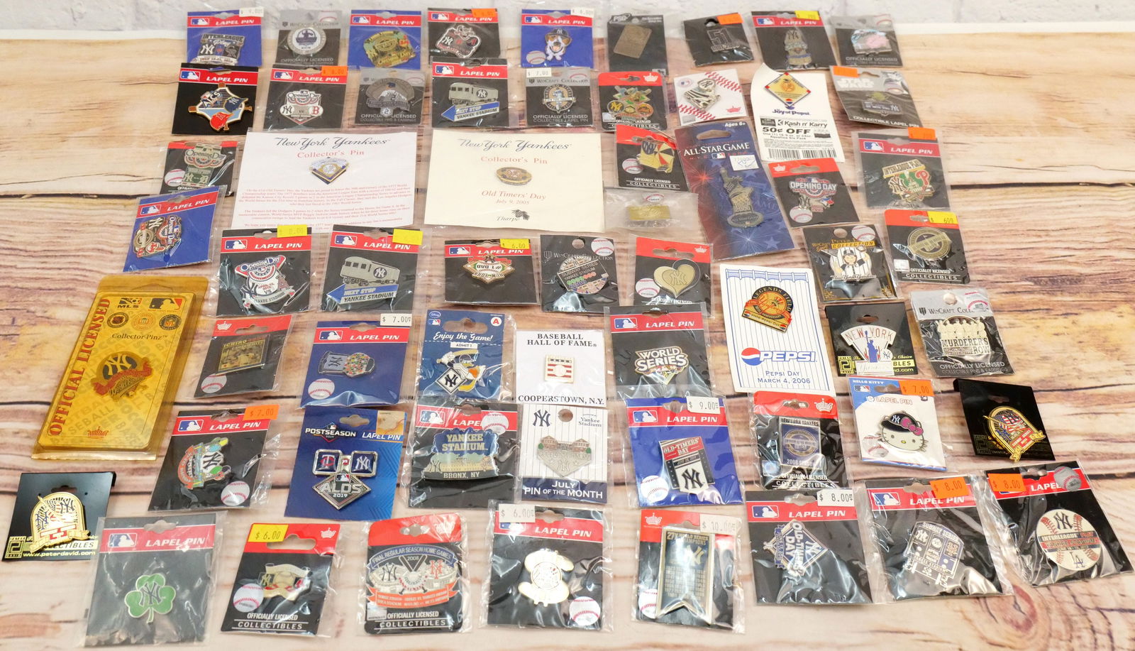 Lot of 60 New York Yankees Pins: Lot of 60 New York Yankees Pins. Including Old Timers Day, Hall of Fame, Mariano Rivera, Opening Day, Hello Kitty, Murderer's Row, 27x Champions and More. All in new condition. All invoices must be pa