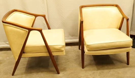 Pair of Mid Century Modern Barrel back Armchairs: Pair of Mid Century Modern Barrel back Armchairs with Leather Upholstery. Has nice V Side Design. Measures 28" tall x 24" wide x 30" deep. All invoices must be paid within 24 hours of the sale. We off