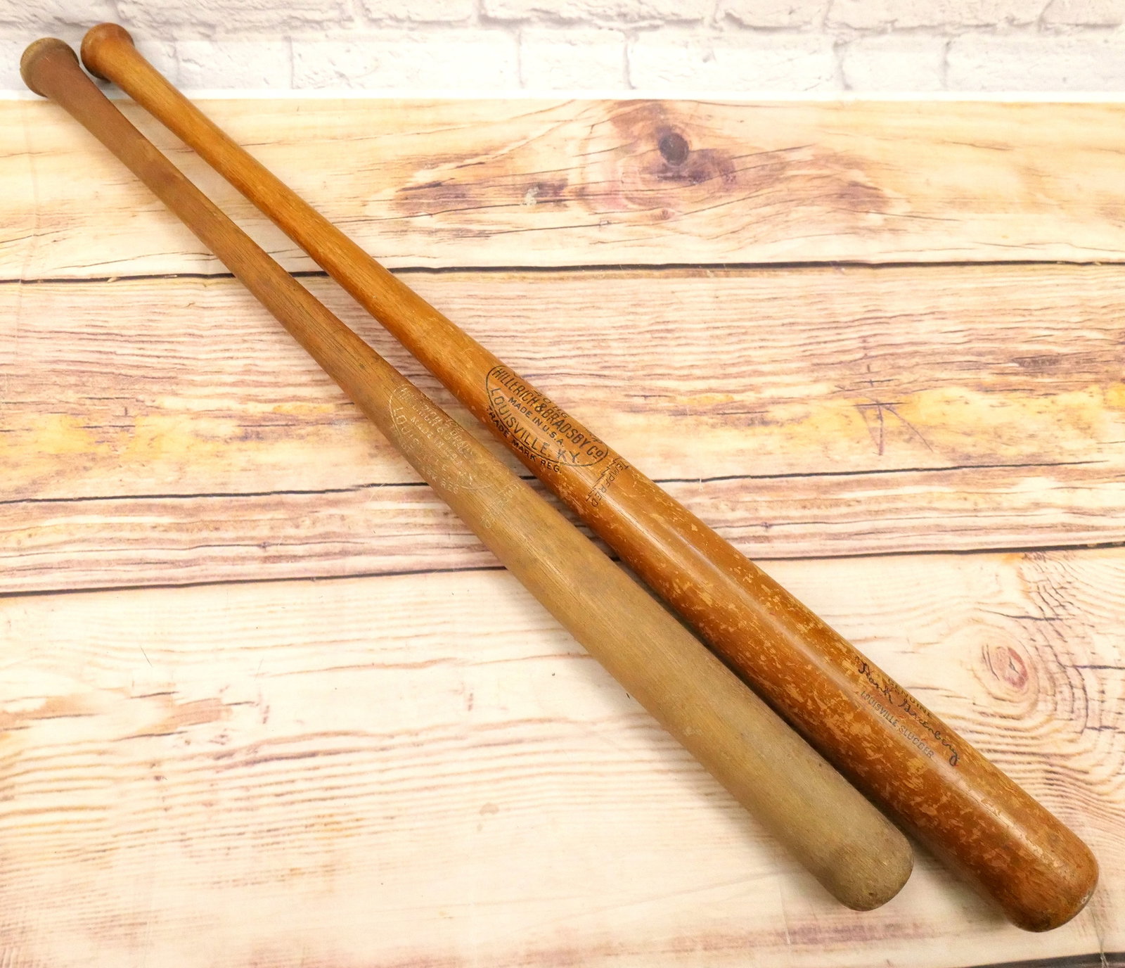 Lot of 2 Hillerich & Bradsby Co. Bats (1934-1949): Lot of 2 Hillerich & Bradsby Co. Bats. Circa 1934-1949. Lot includes Hank Greenberg Louisville Slugger 40 H.G. and Unnamed No. 102 Louisville Slugger. Largest measures 35.5" long. All bats are conside