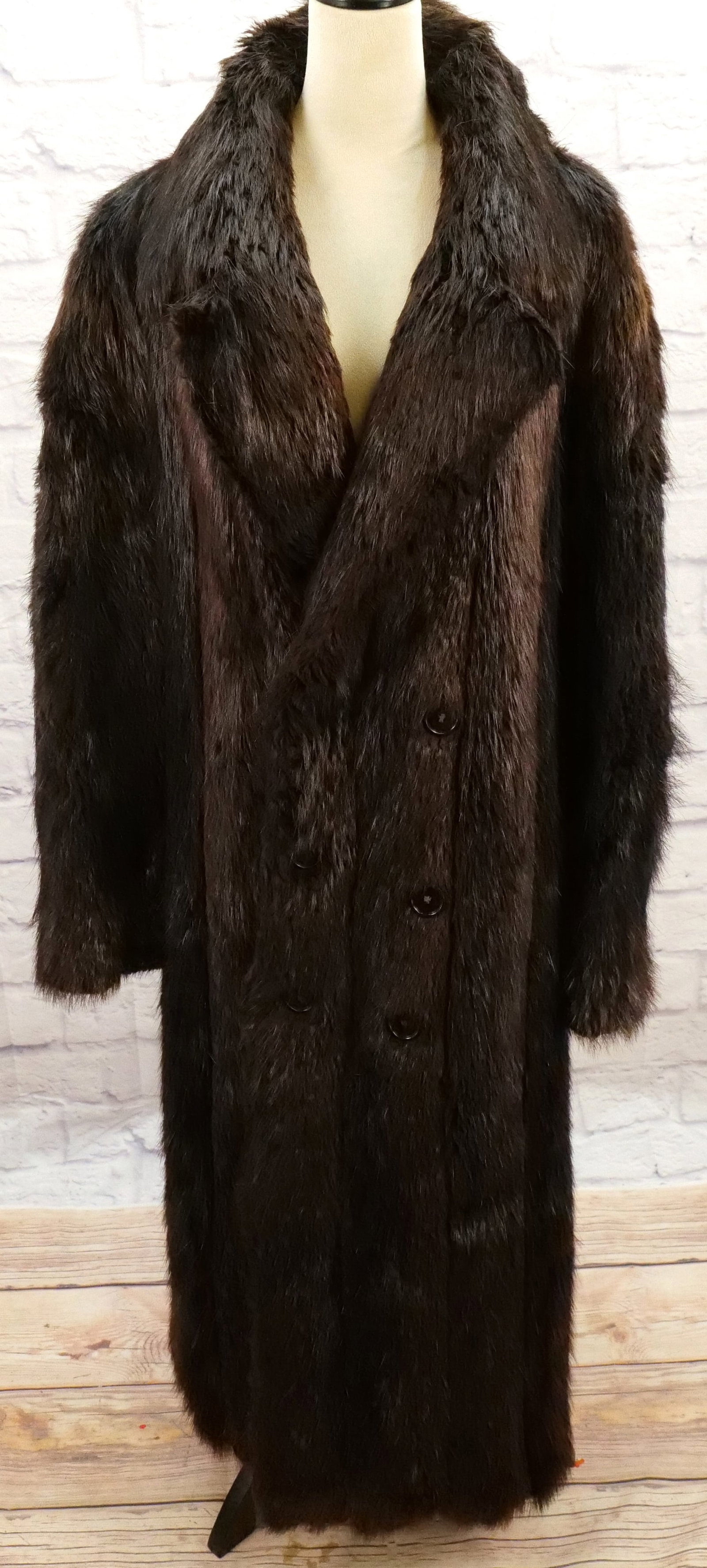 Men's Fur Coat: Men's Fur Coat from Schultz Furriers. Has wear spot on inside left lining, a split to the pelt at the back and wear to the shoulder. All measurements are done laying flat. Measures 26" wide x 56" long